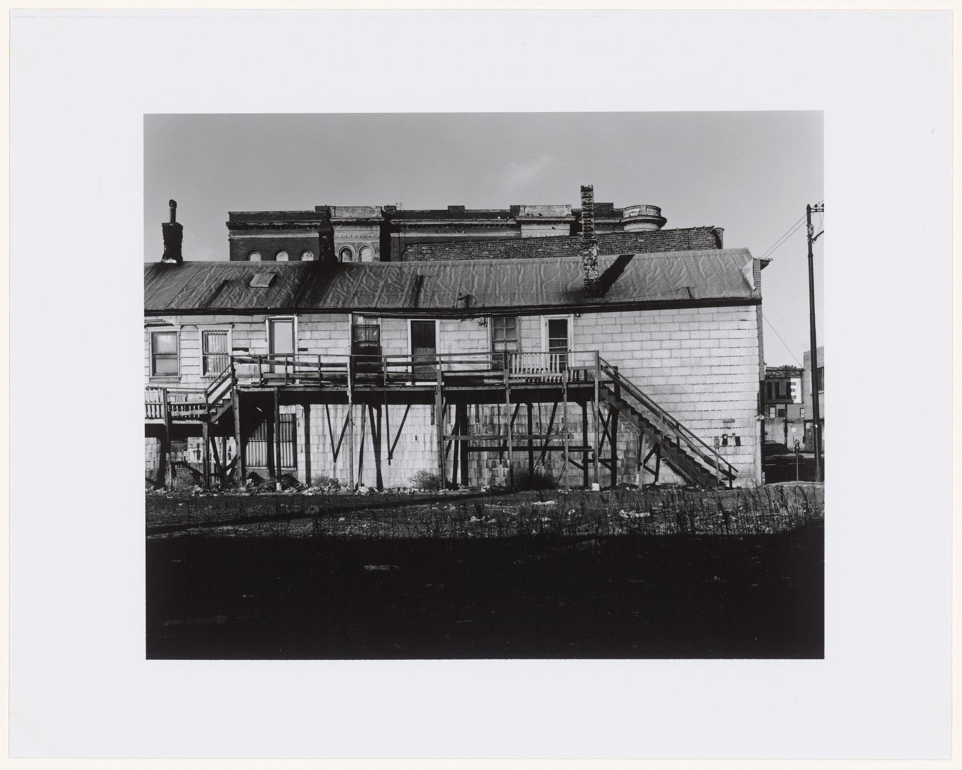 View of a deteriorating building showing a balcony and a staircase, North Avenue, Chicago, Illinois, United States