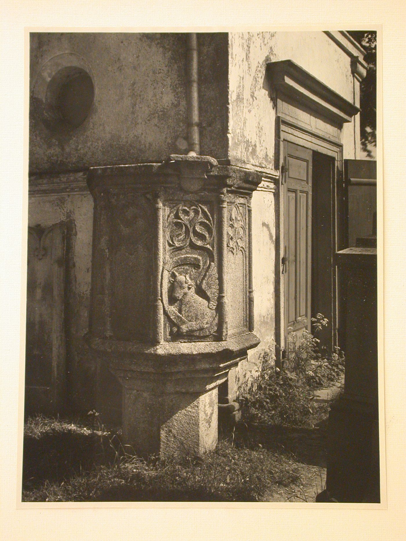 Close-up view of a stone container with relief carvings used for water collection, Telc, Czechoslovakia (now Czech Republic)