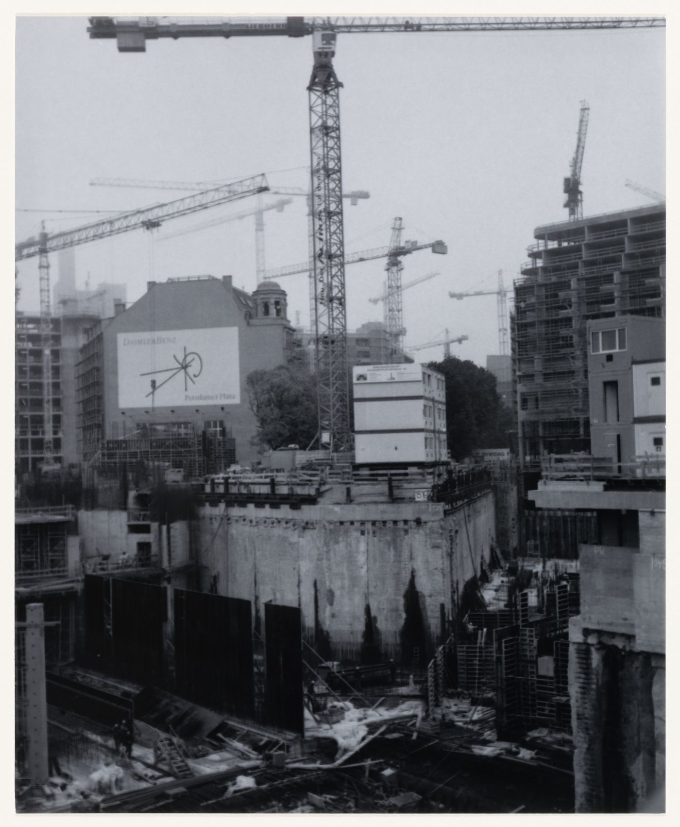 View of construction site, jib cranes and buildings, Berlin, Germany, from the artist book "The Potsdamer Project"