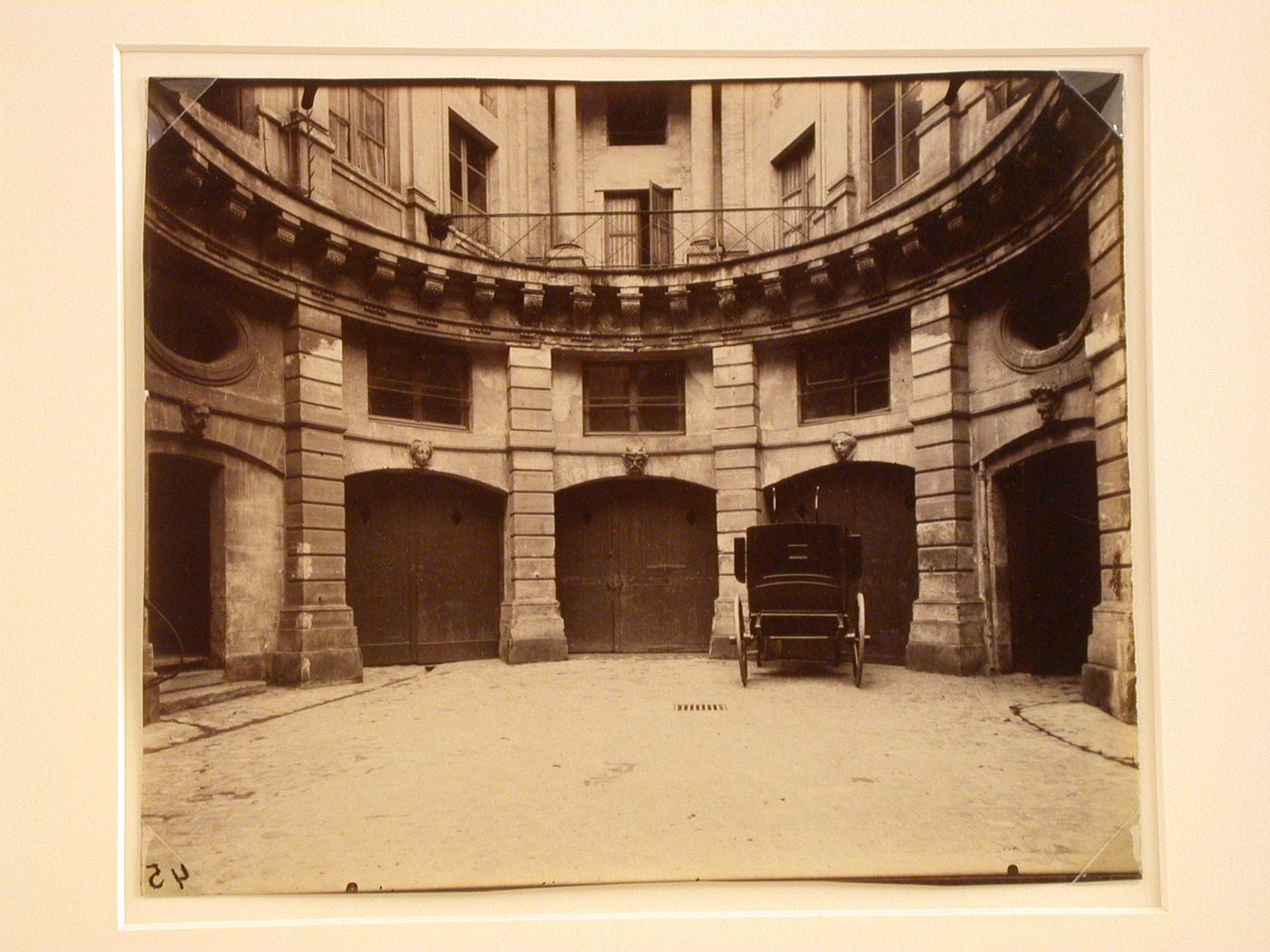 Hôtel de Beauvais: Back of courtyard showing garage doors and automobile, Paris, France