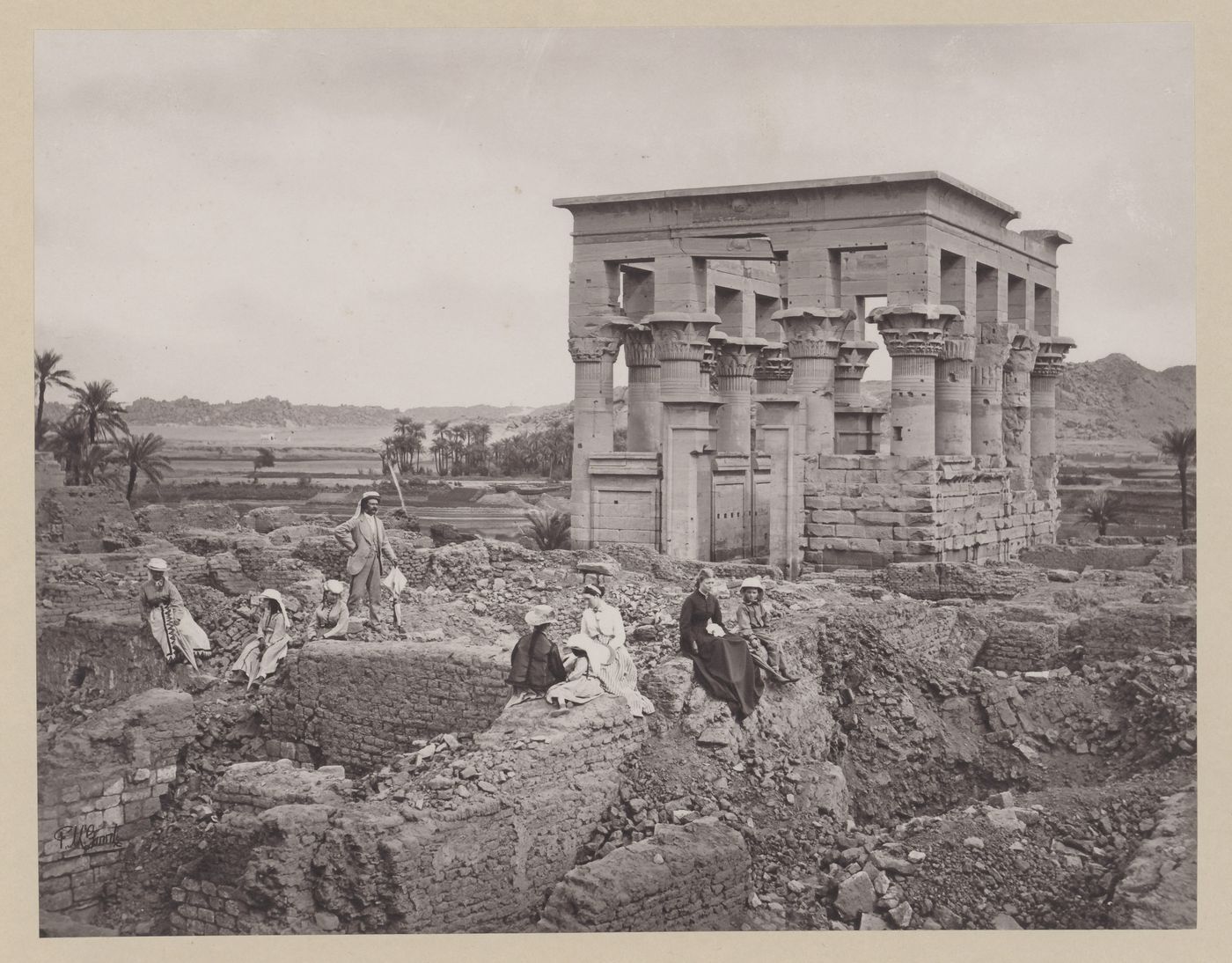 Kiosk of Trajan, west face, tourist group in foreground, Philae, Egypt