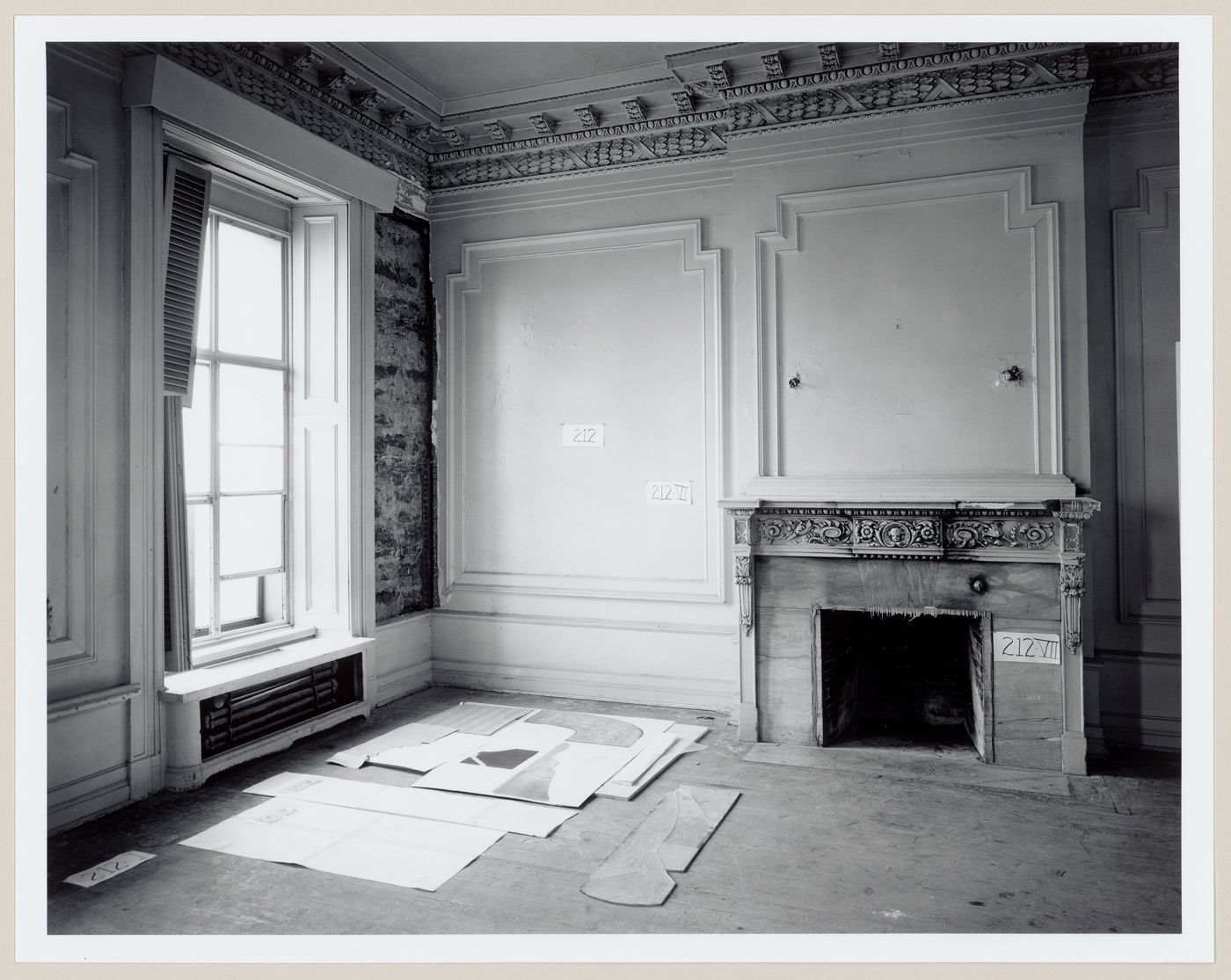 Interior view of a reception room showing a window and a fireplace, Shaughnessy House under renovation, Montréal, Québec