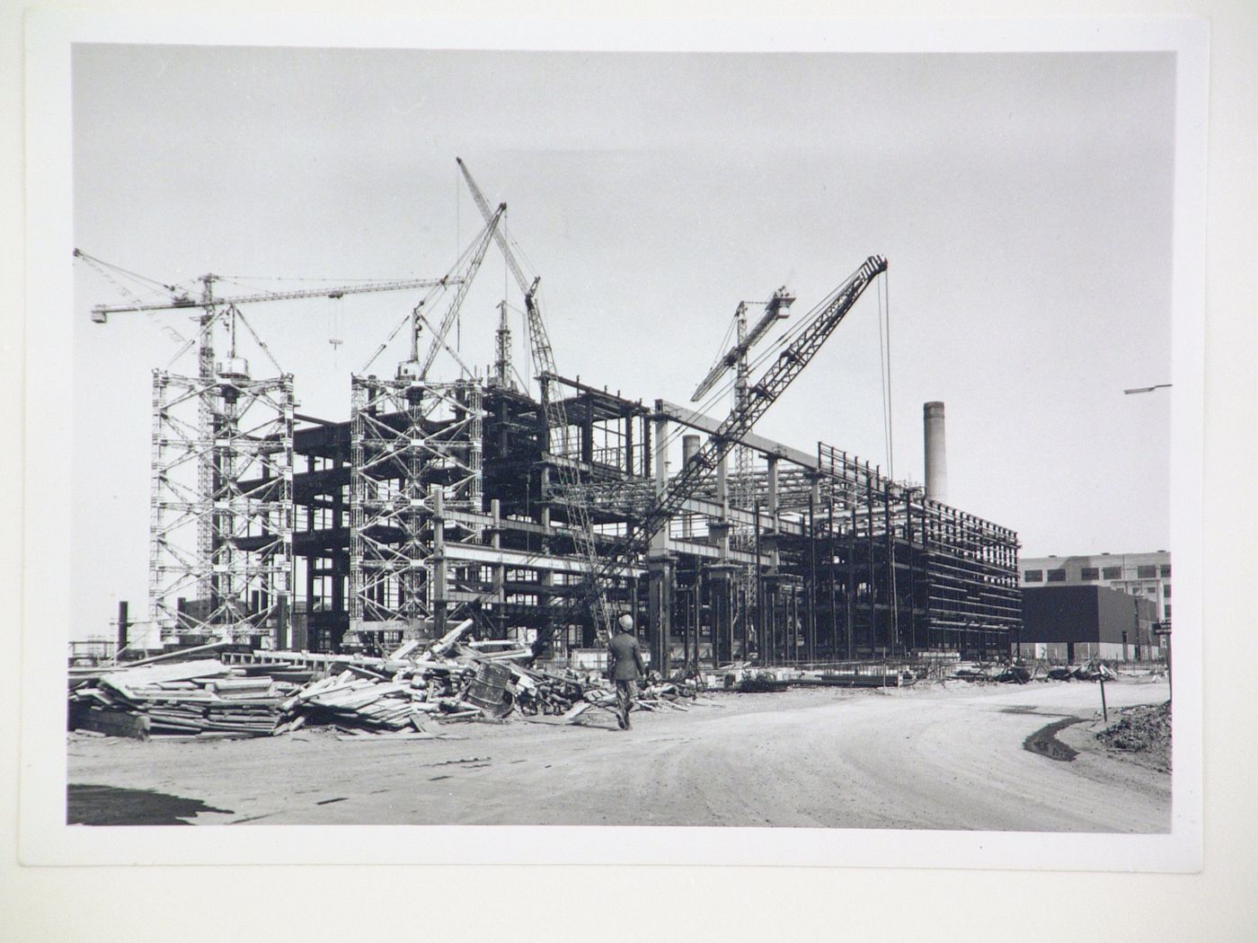 View of crane and construction of steel structure for power station, United Kingdom