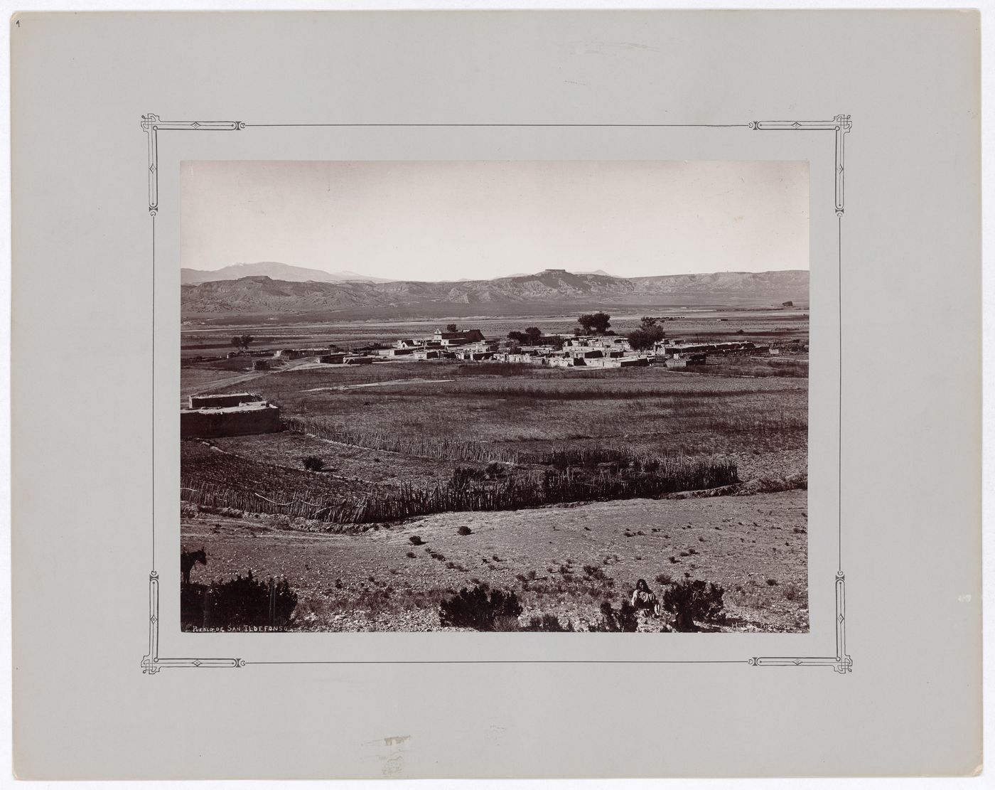 Distant view of Po-woh-ge-oweenge (San Ildefonso Pueblo) showing cultivated land with the Rio Grande in the background, New Mexico, United States