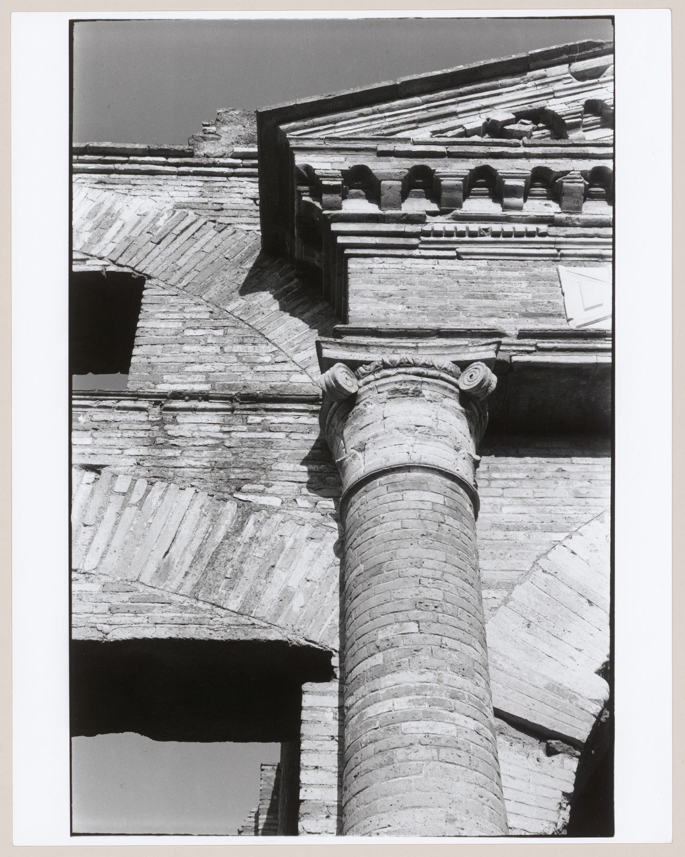 Partial view of the main entrance to the Horrea Epagathiana and Epaphroditiana showing a column, entablature and pediment, Ostia, Italy