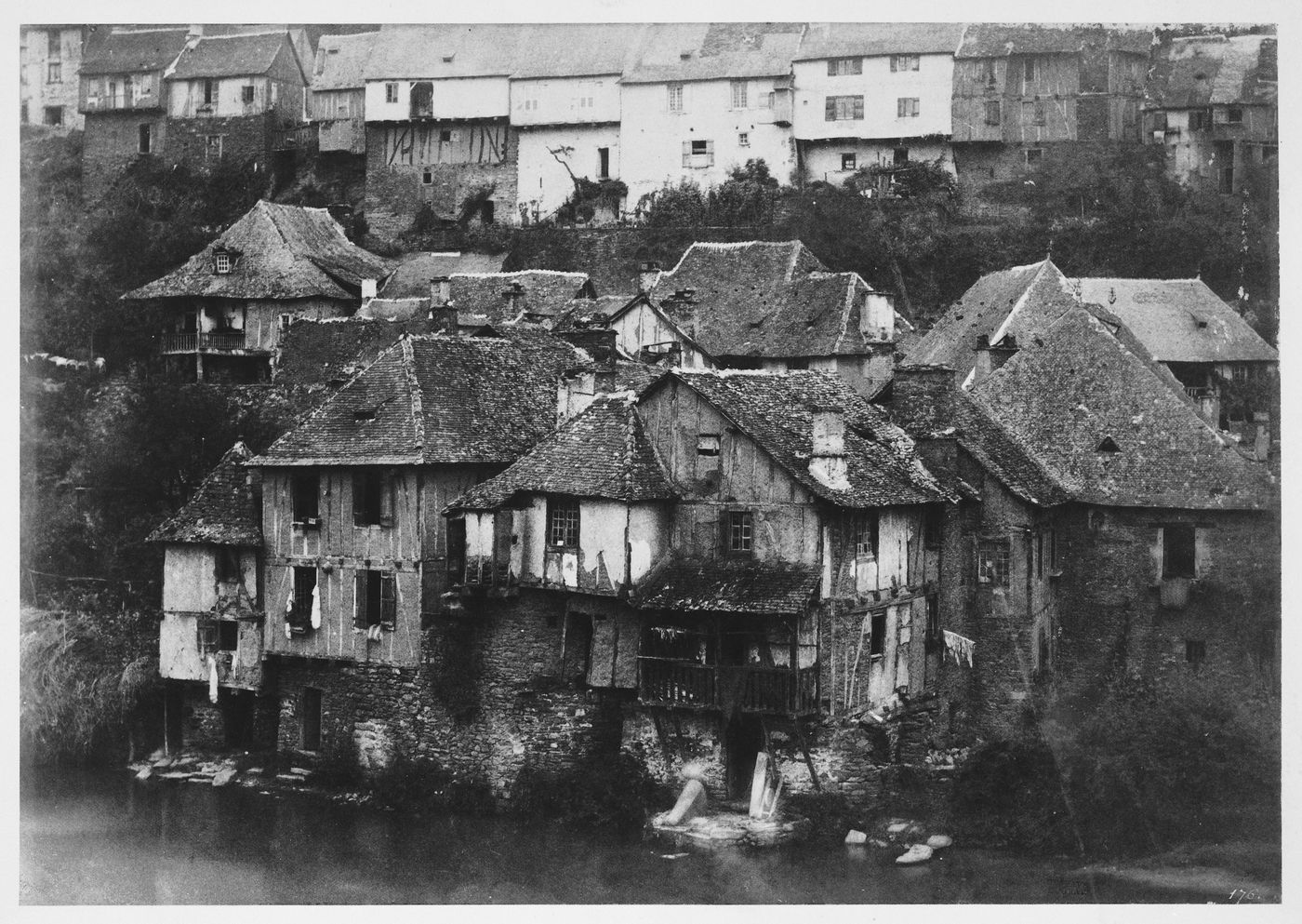 Group of houses by waterside, France