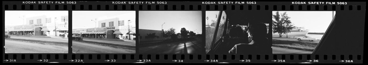 Strip of negatives of stores and street views, Miami, Florida