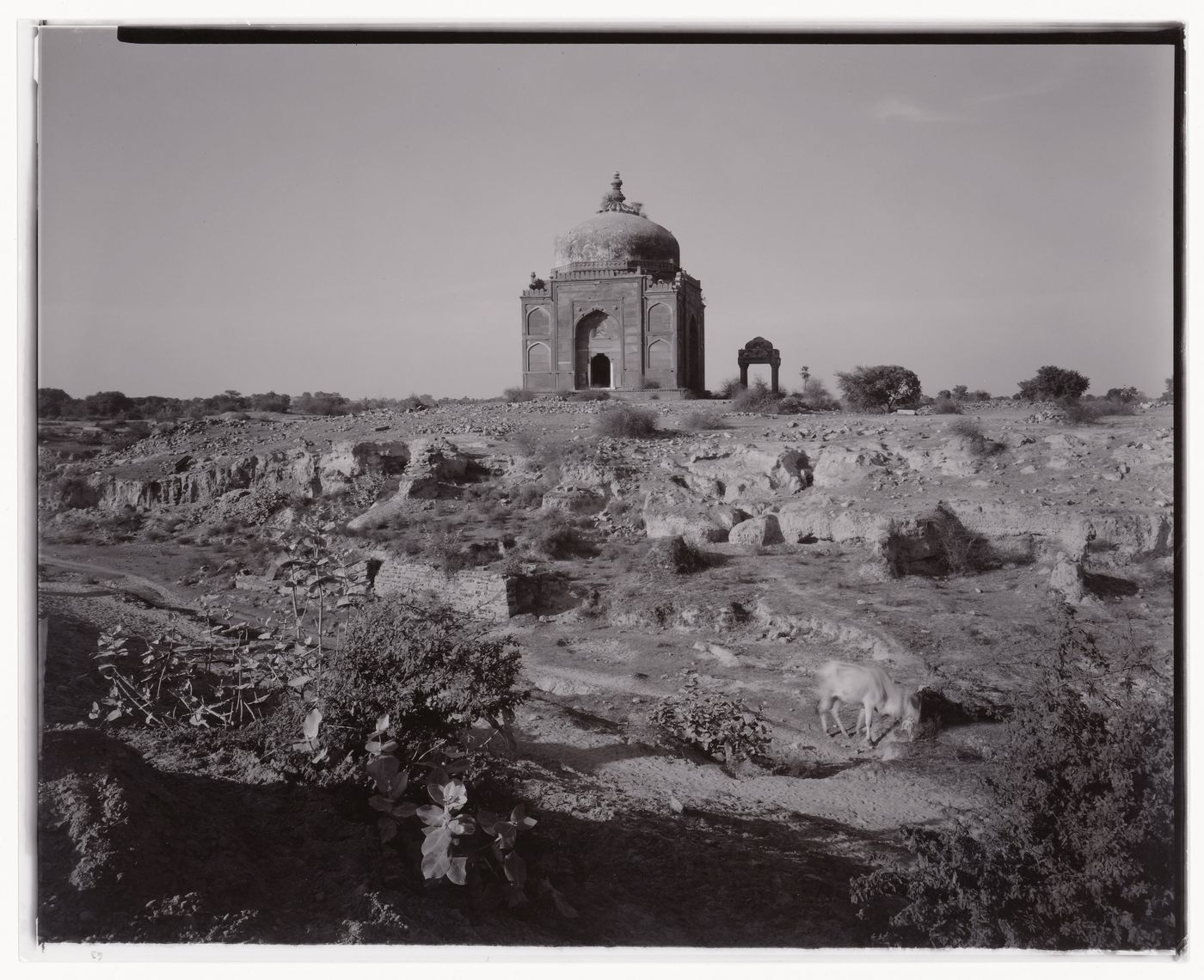 View of a tomb in the midst of rugged terrain, India