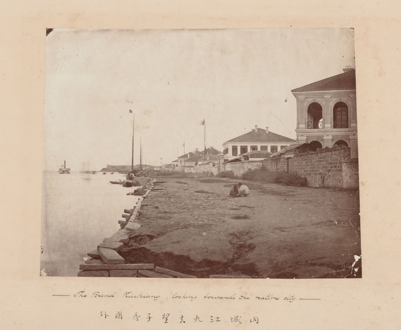 View of embanked quay in the British Concession with city wall in the background, Kiukiang (now Jiujiang), China