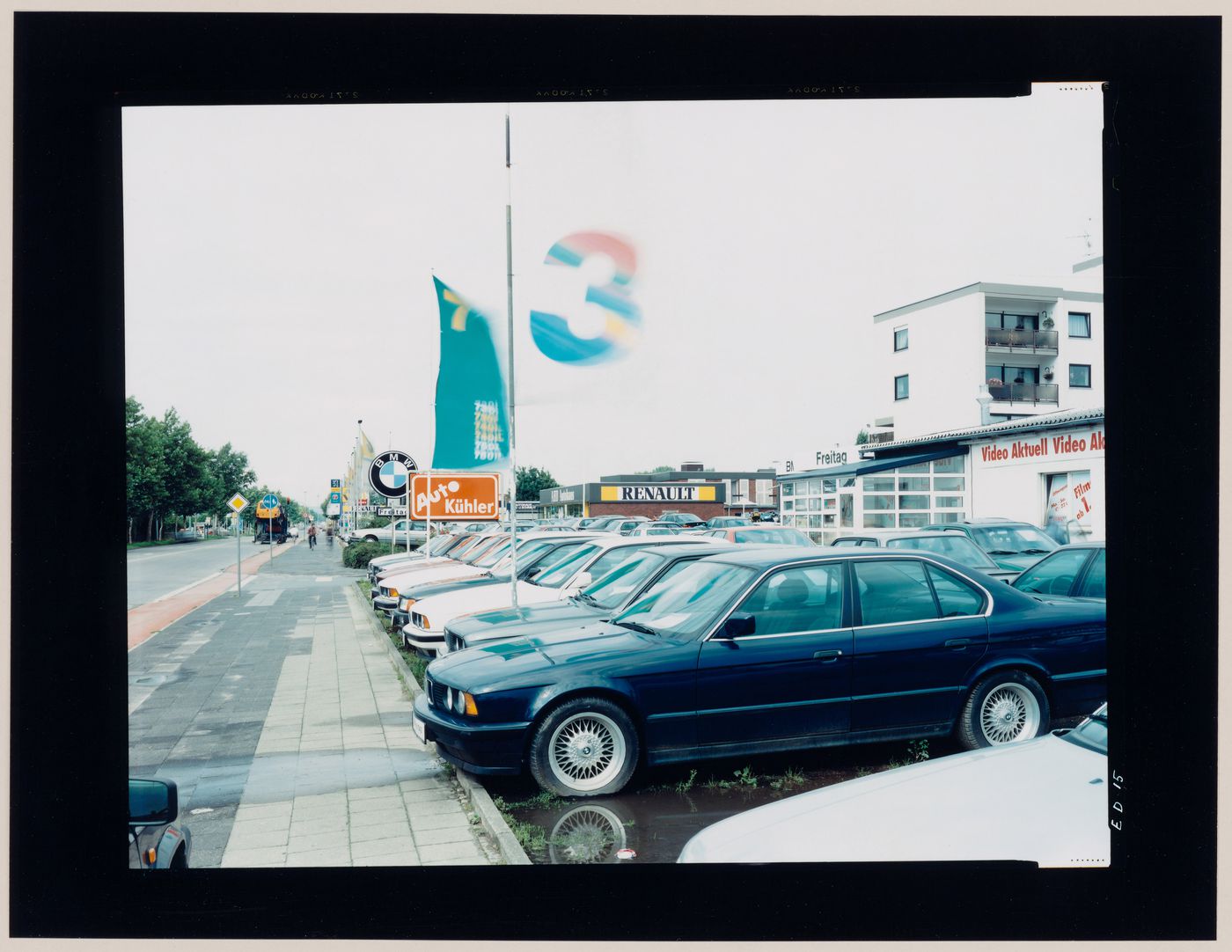 View of an automobile showroom showing automobiles and buildings, Bochum, Germany (from the series "In between cities")