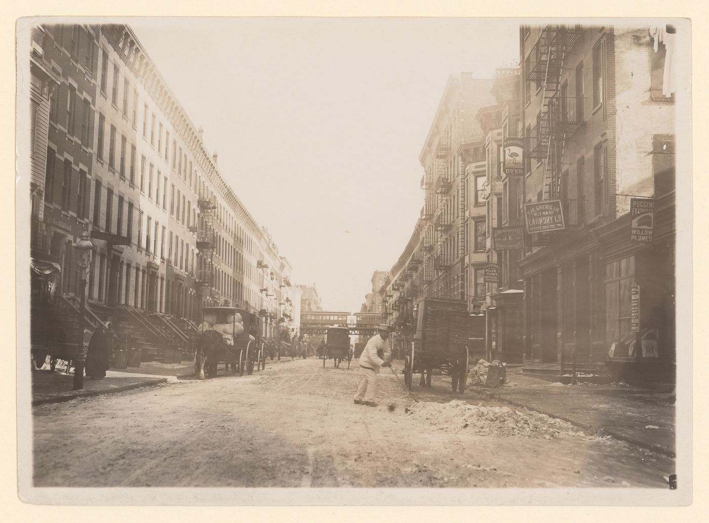 Man shoveling in street, New York City, New York