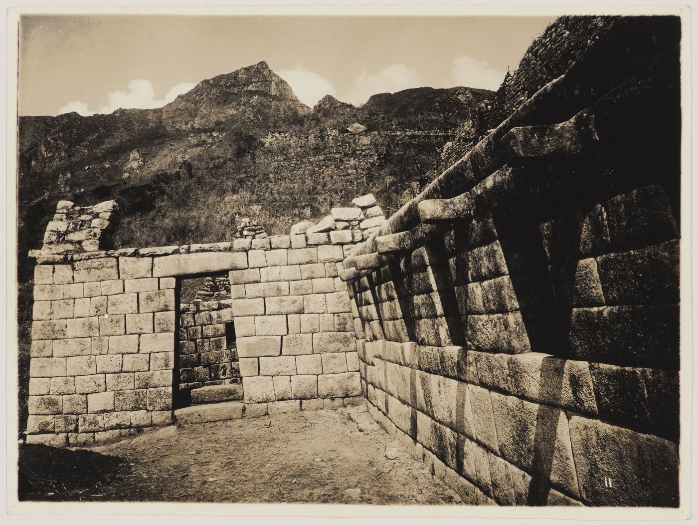 View of unidentified buildings with mountains in the background, Machu Picchu, Peru
