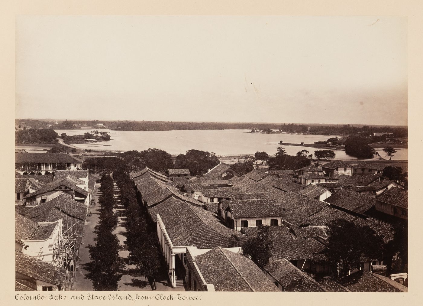 View of Beira Lake and Slave Island from clock tower and lighthouse with buildings in the foreground, Colombo, Ceylon (now Sri Lanka)