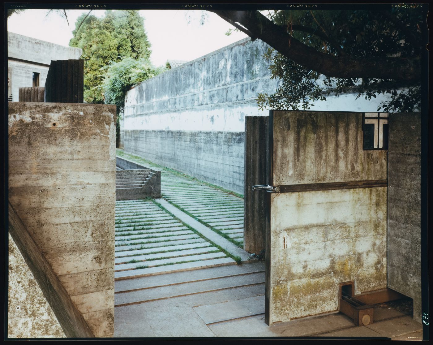 View of the Lych gate with the chapel and a wall in the background, Cimitero Brion, San Vito d'Altivole, near Asolo, Italy