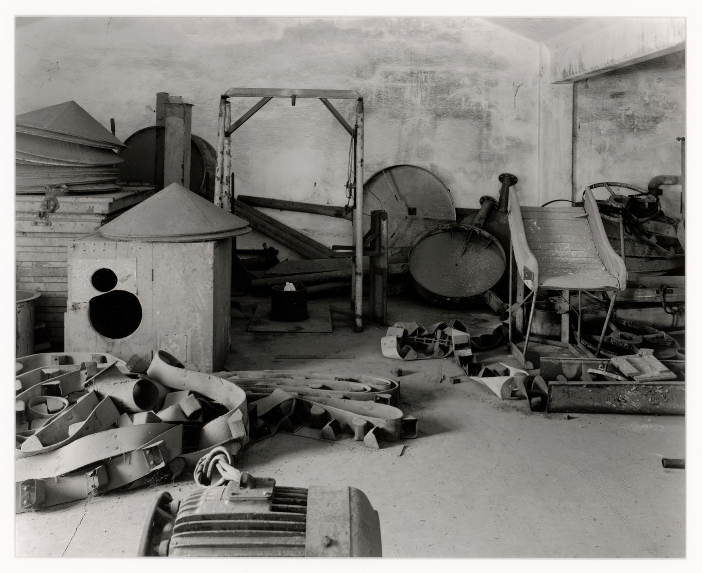 Interior view of a room showing scrap metal, Malteria Adriatica, Marghera, Italy