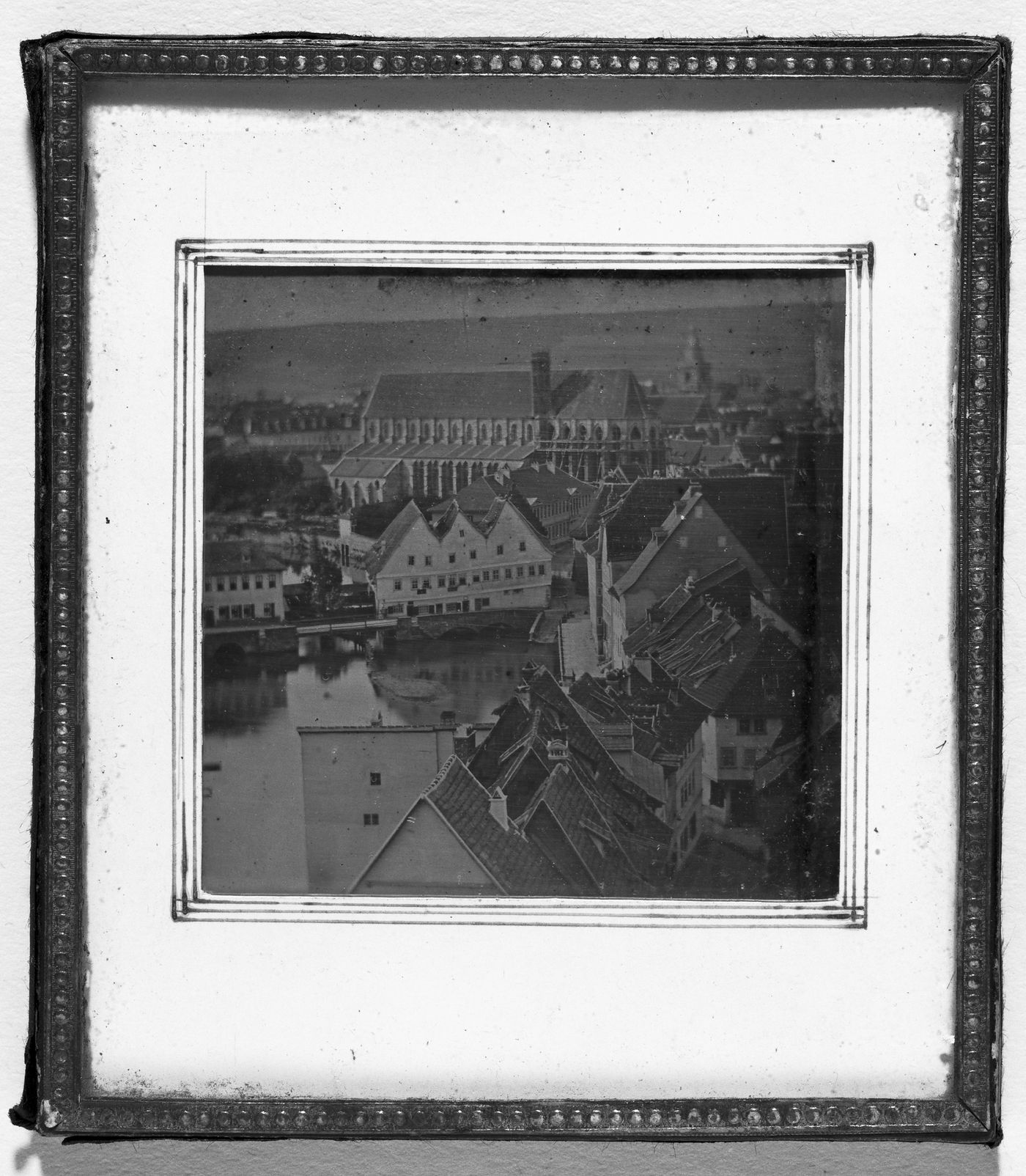 View of the rooftops of Erfurt with the Barfüsserkirche under reconstruction in the background, Germany