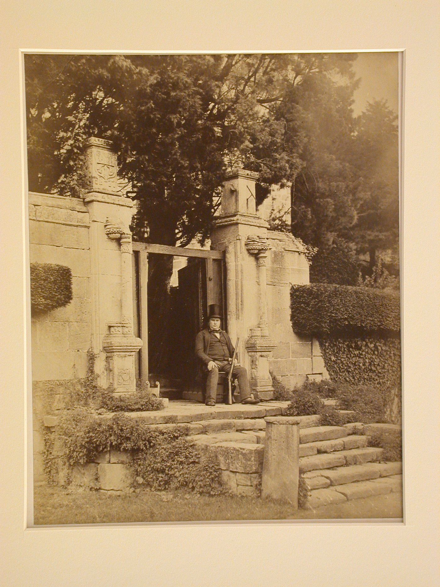 View of ruined portal, man with gun seated before, Yorkshire, England