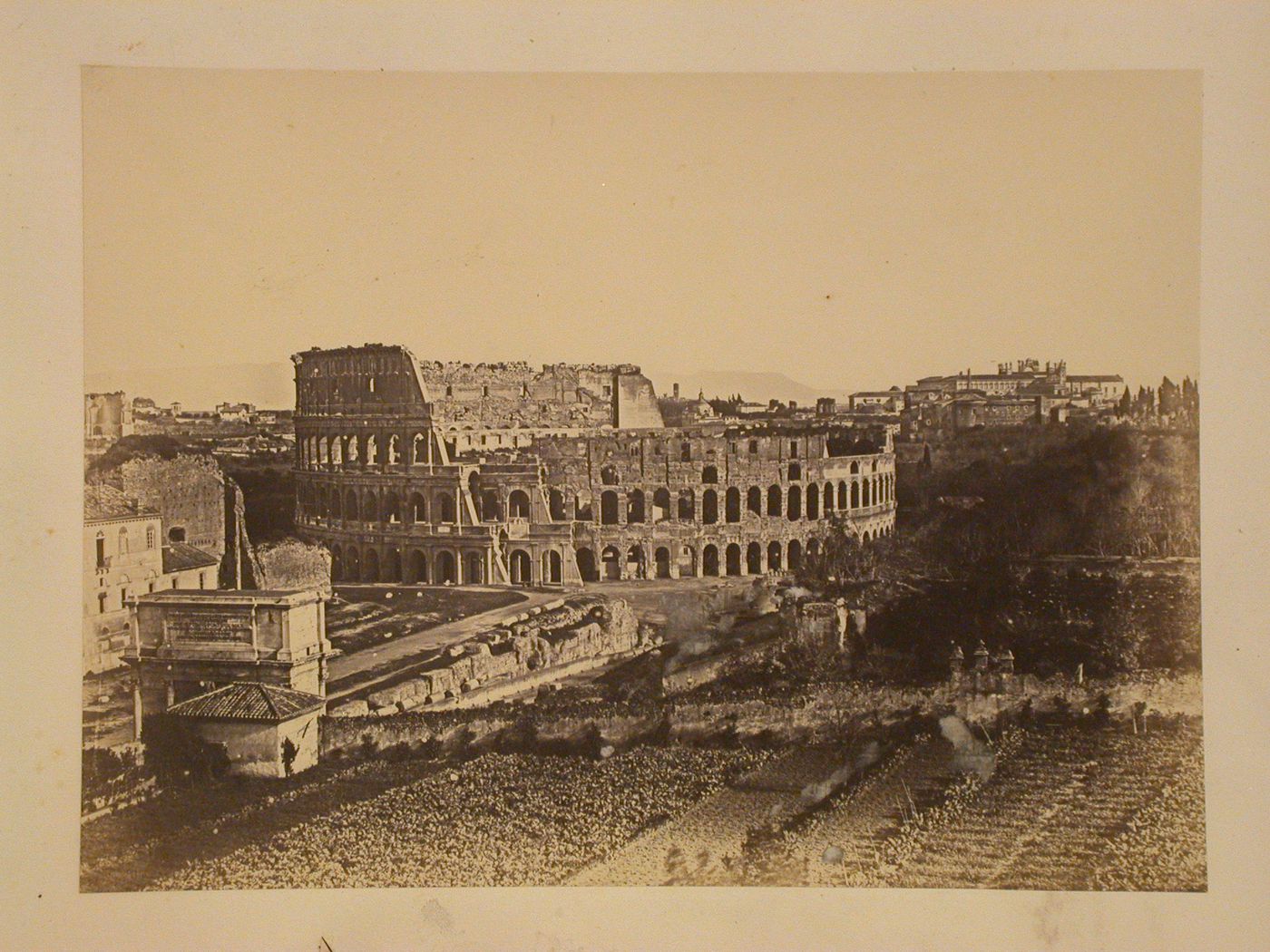 View of the Colosseum, exterior, and the Arch of Septimus Severus, in Roman Forum, Rome, Italy
