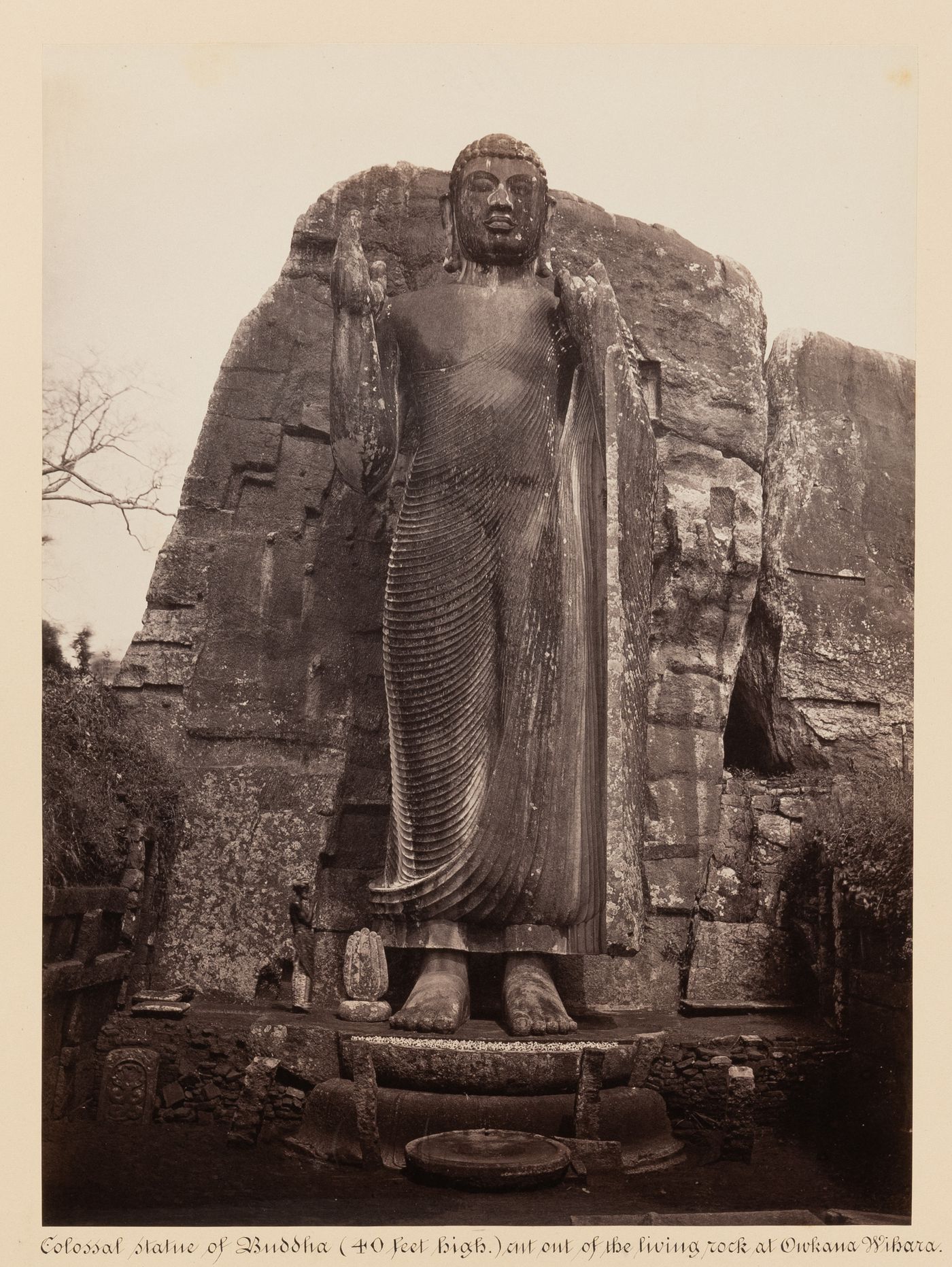 View of a statue of Buddha, Avukana, Ceylon (now Sri Lanka)