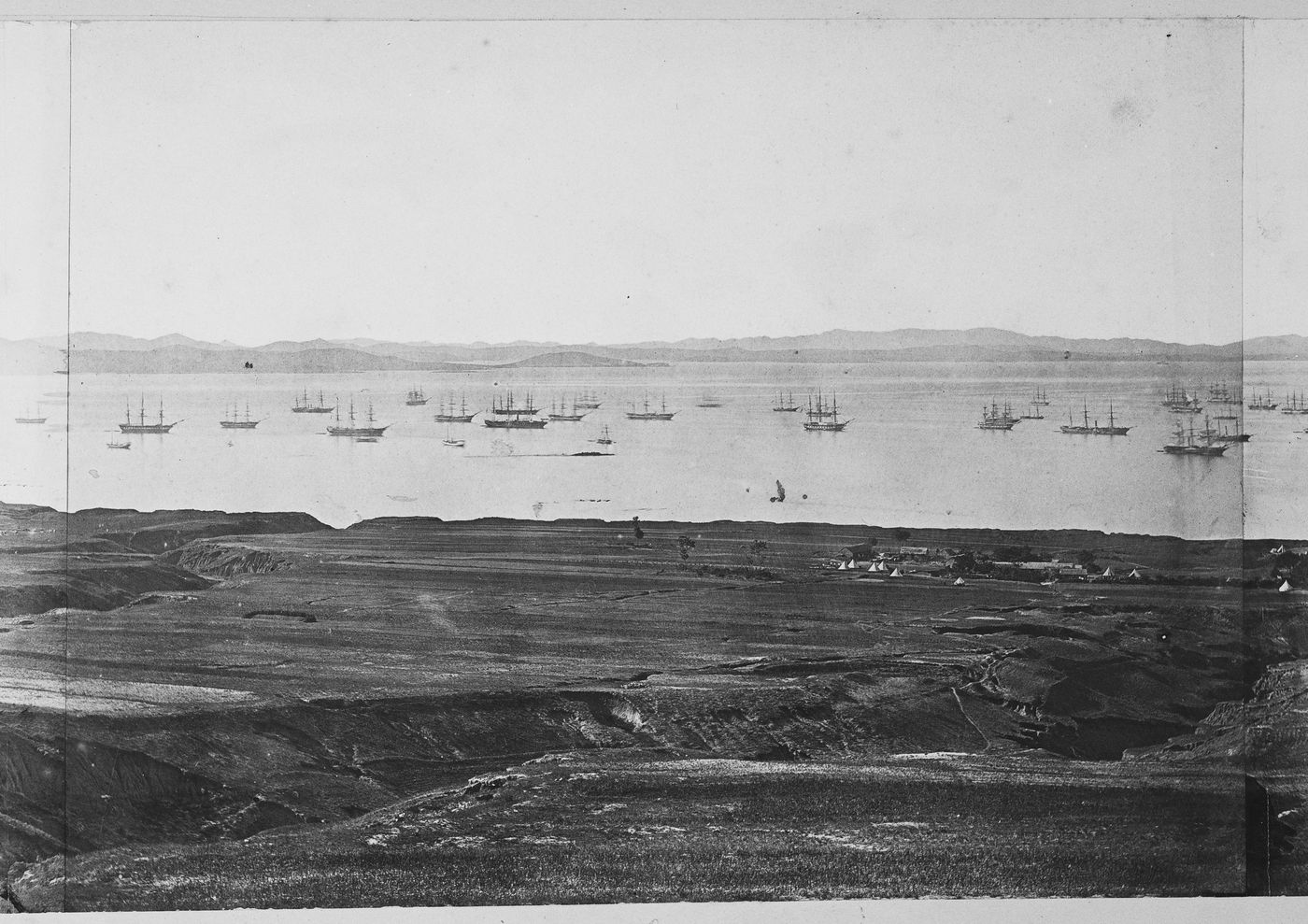 View of Victoria Bay, adjacent to Talien Bay (now Dalian Wan), showing military camps and farmland, near Ch'ing-ni-wa (now part of Dalian), China