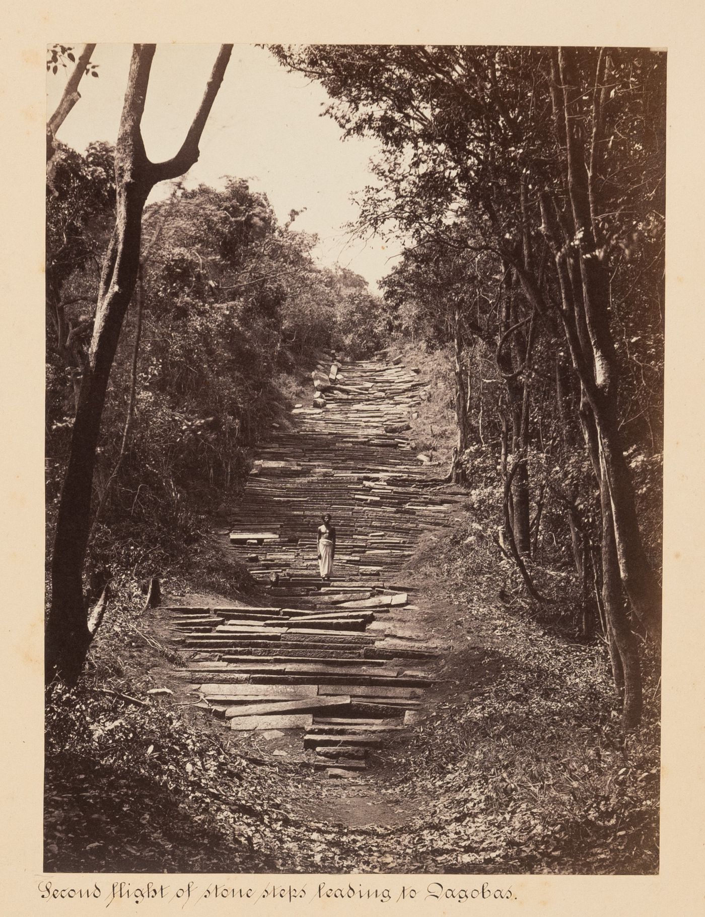 View of a rock staircase and a man, Mihintale, Ceylon (now Sri Lanka)