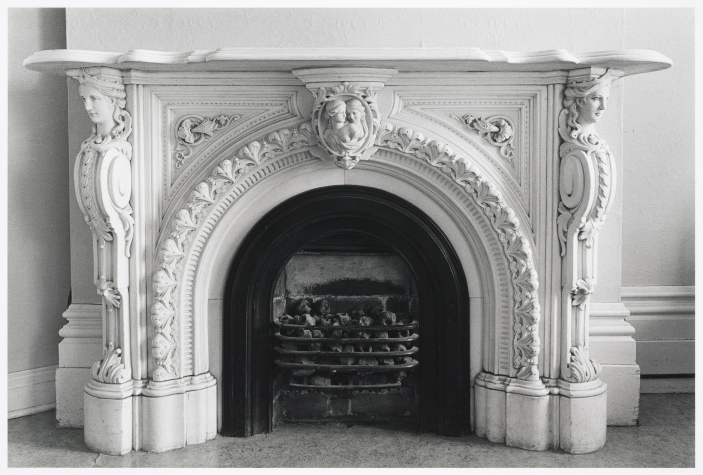 Interior view of the marble fireplace in a front room in the west part of Shaughnessy House (now the Grand Salon ?), Montréal, Québec