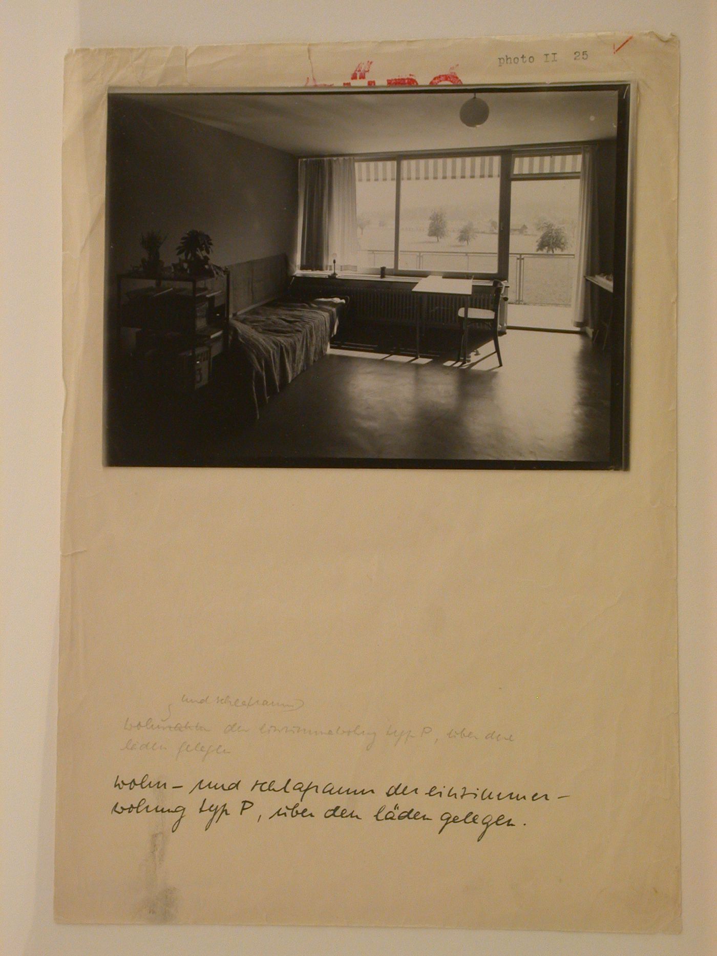 Interior view of the living room and bedroom of a Type P1 model apartment showing a table designed by Max Ernst Haefeli, Werkbundsiedlung Neubühl, Zurich, Switzerland