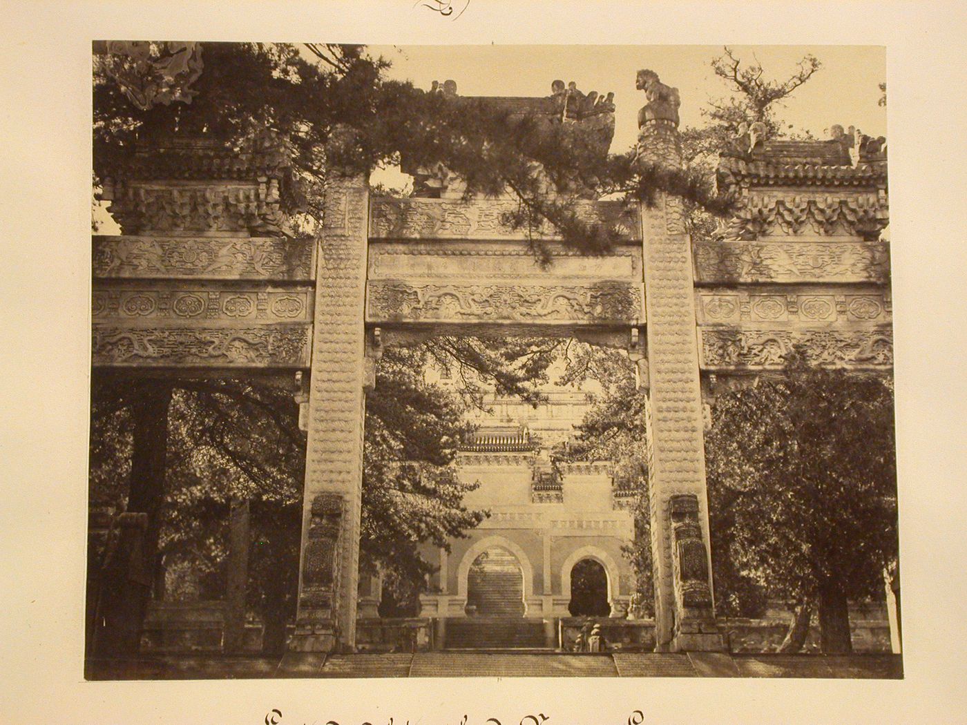 View of the three-arched gateway leading to the Diamond Throne Pagoda in the Azure Clouds Monastery [Biyun Si], seen through a p'ai-lou, Peking (now Beijing), China