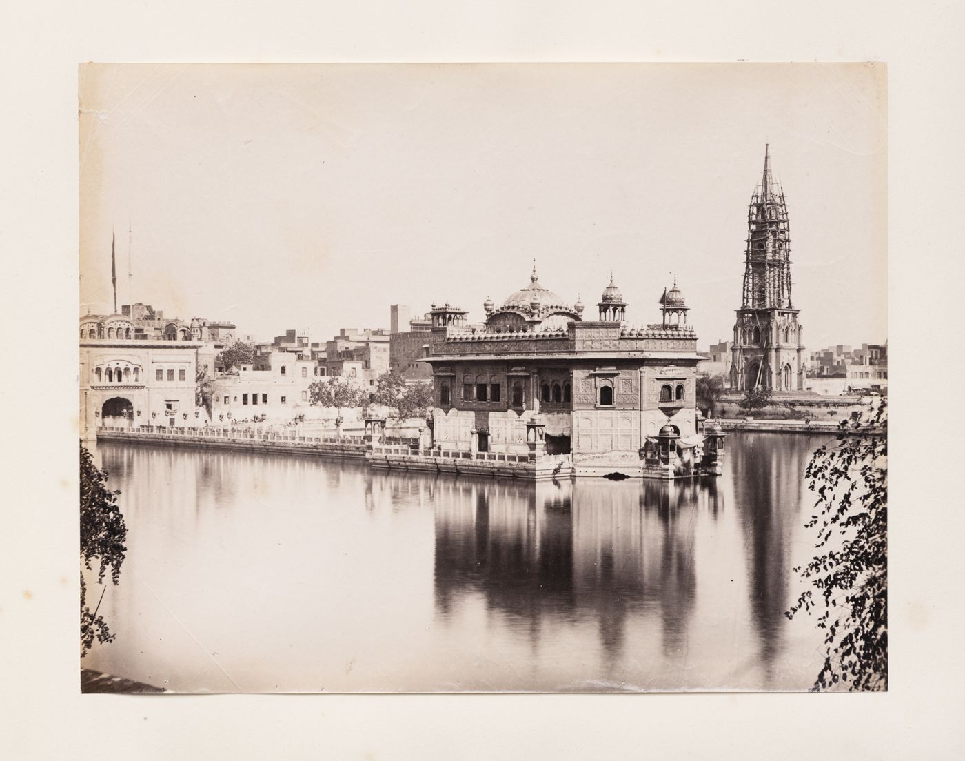 View of the Golden Temple (also known as Darbar Sahib) and a tower under restoration, Amritsar, India