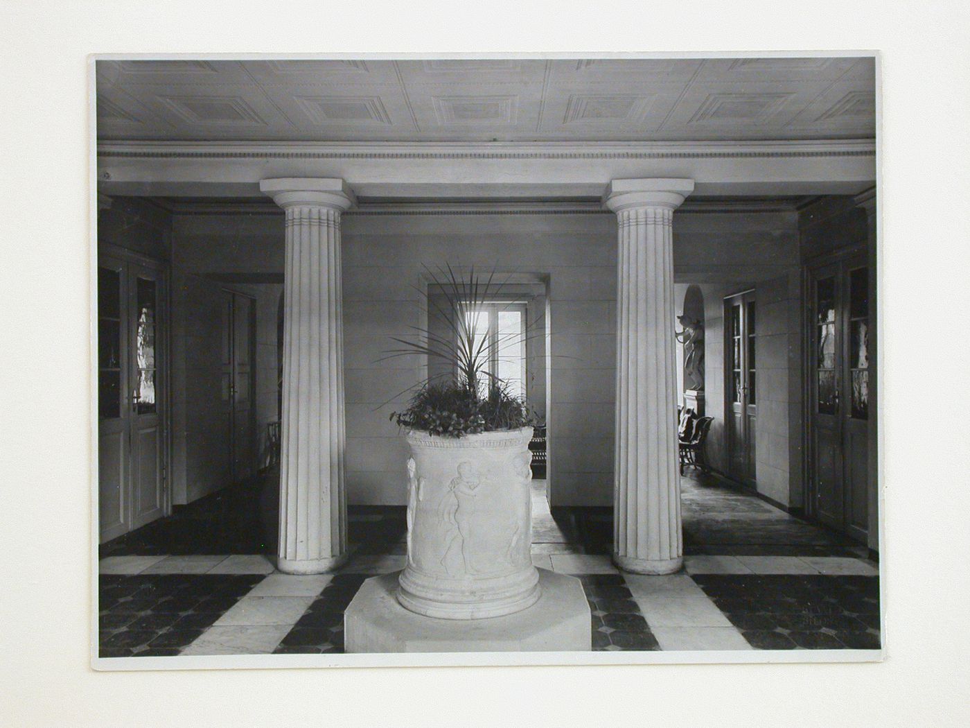 Interior view of the vestibule entrance of the Schloss Wilhelm von Humbolt with a large flowerpot in the foreground, Tegel, Berlin, Germany