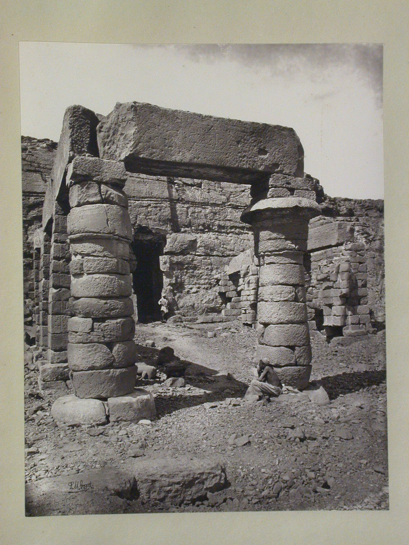 View of portico, temple of Gerf Hussein, with two local men, Lower Nubia (partially relocated to New Kalabsha), Egypt