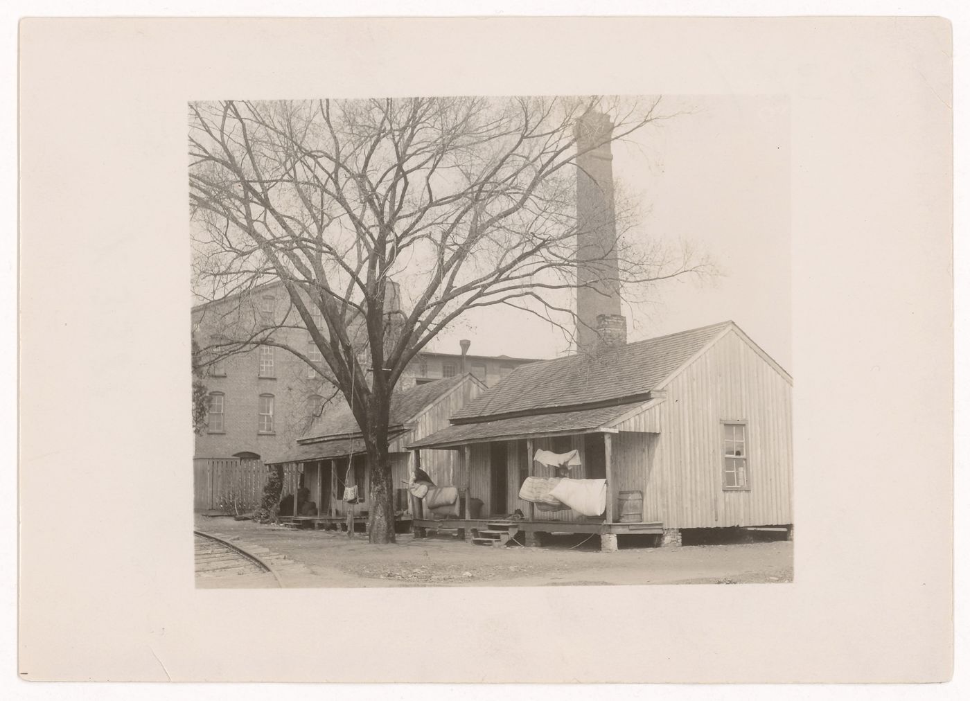 View of housing for workers next to Floyd Cotton Mill, with railroad in foreground, Rome, Georgia, United States