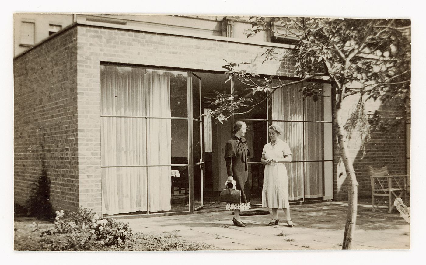 Two women standing on the patio of the Karl Lemke House, Berlin