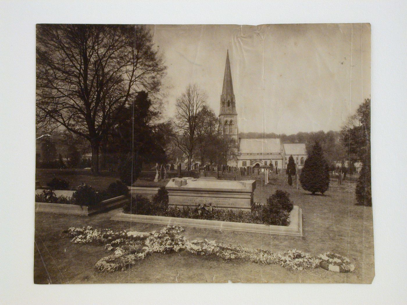 View of the grave of William Spencer Cavendish, 6th Duke of Devonshire, showing the church of St. Peter's in the distance, Edensor Village, Derbyshire, England