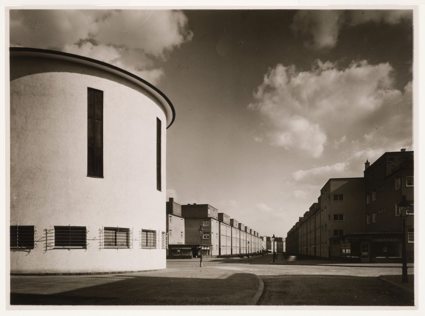 Apse [?] of church at left, with long perspectival recession past apartment houses, Cologne, Germany