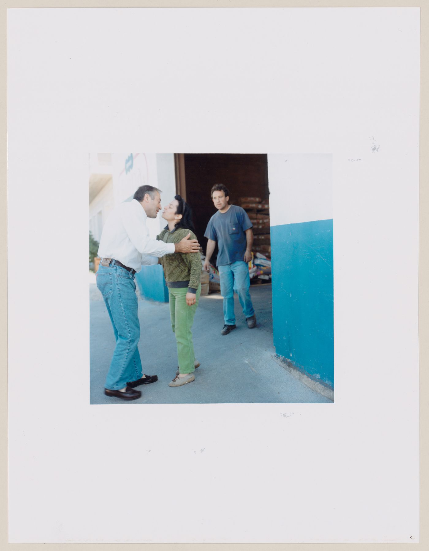 Group portrait of three people standing in the entrance of a building, Paradela, Lugo Province, Spain (from the series "In between cities")