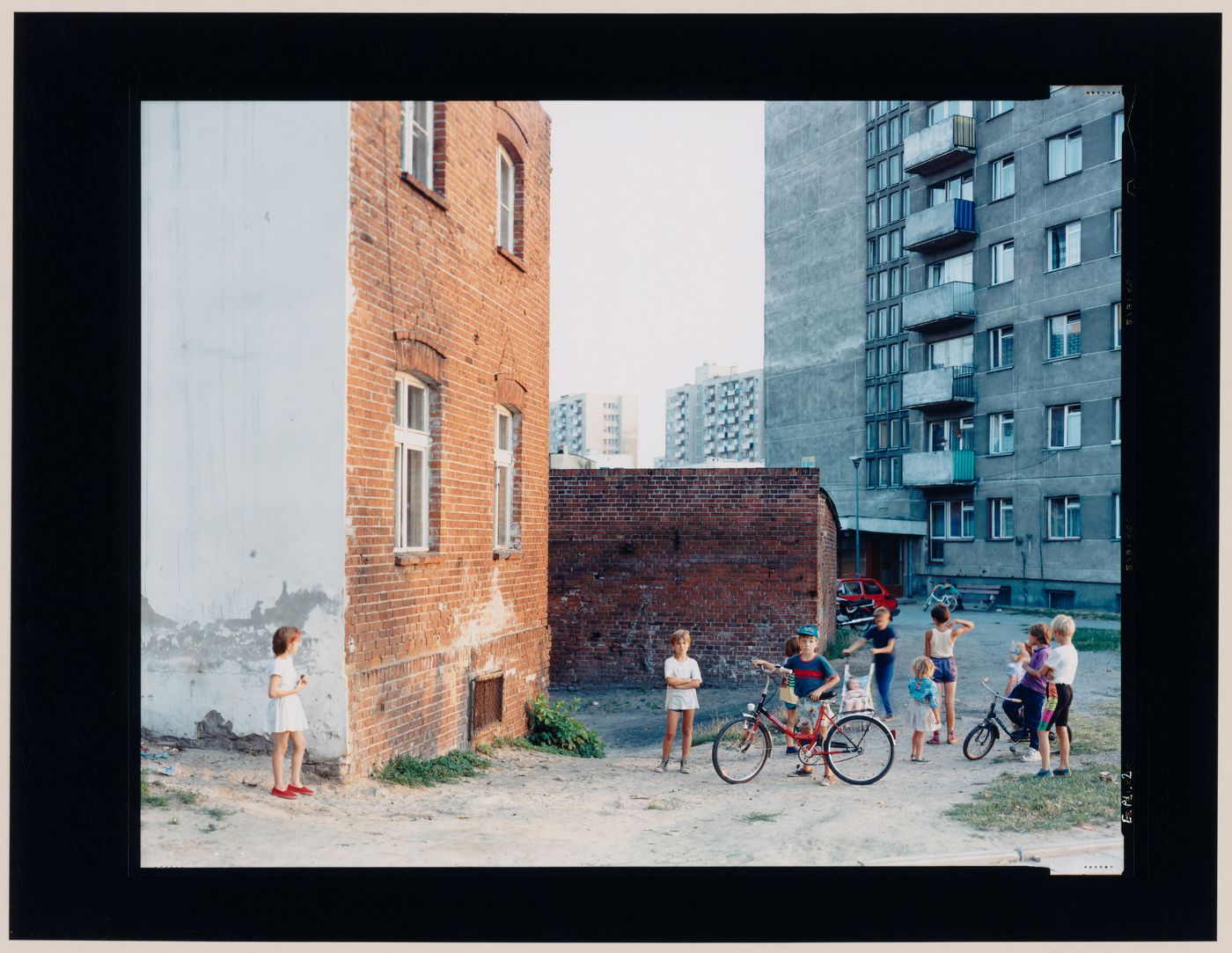 View of apartment houses and children, Malbork, Poland (from the series "In between cities")