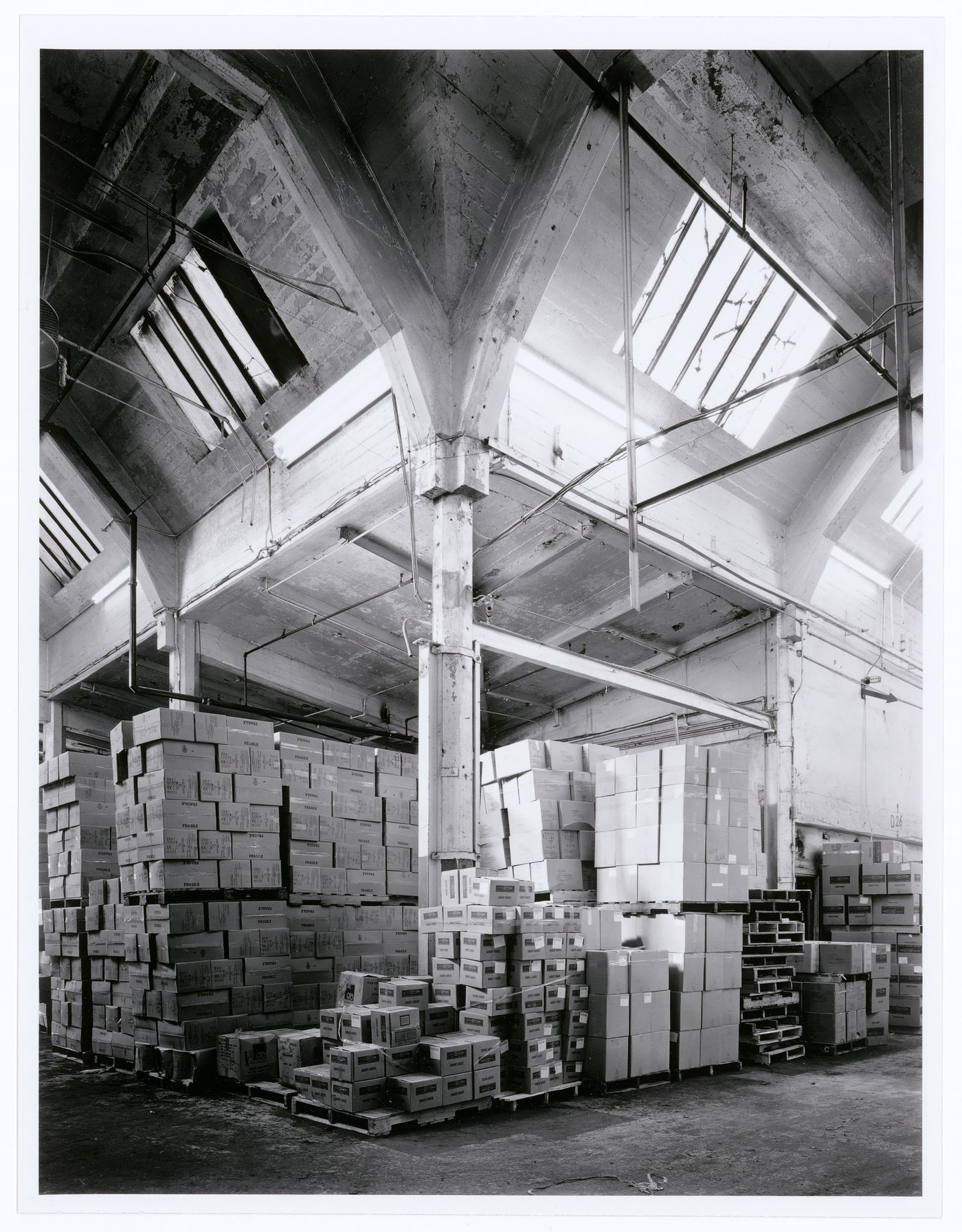 Interior view of the west room of the Crane Foundry showing a column and a double vault, Montréal, Québec