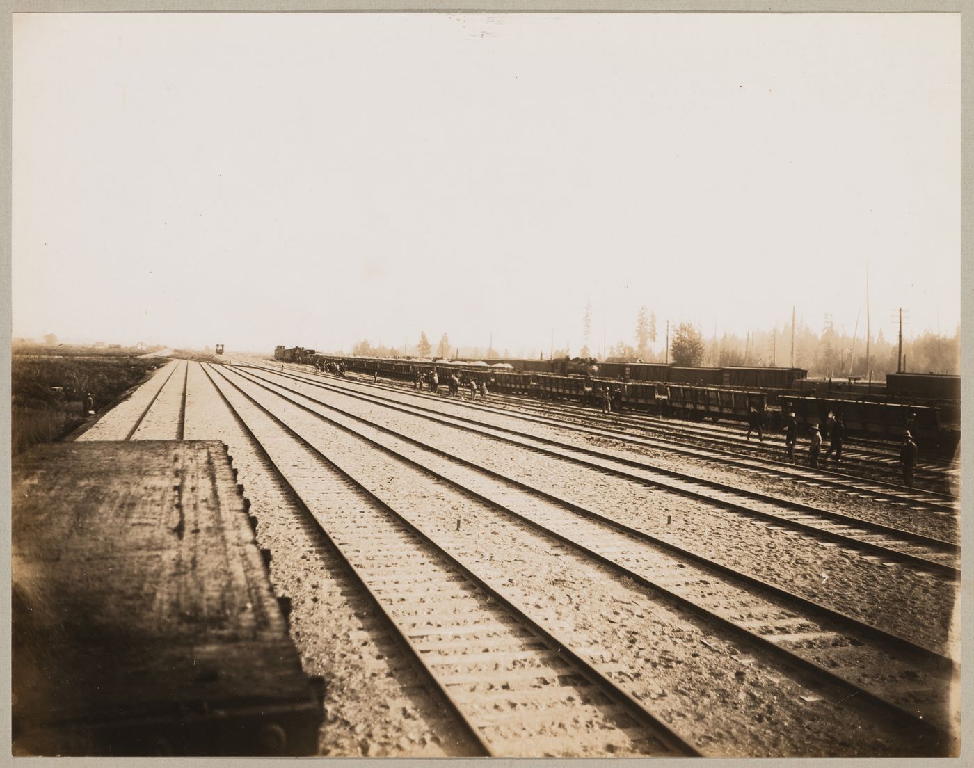 View of the Canadian Pacific Railroad Company freight yards showing workers and trains, Coquitlam (now Port Coquitlam), British Columbia