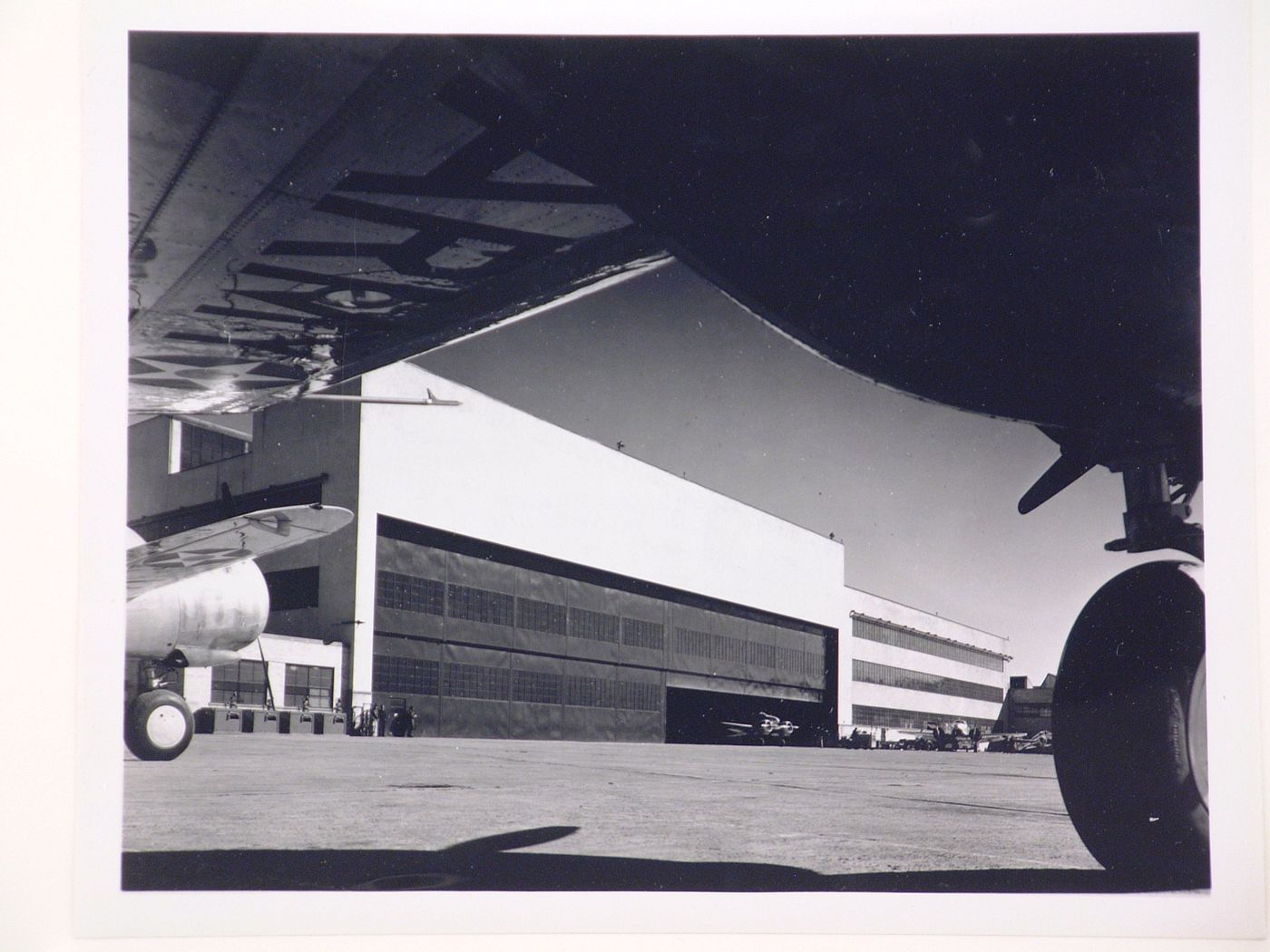 View of the south façade of the Assembly Building from beneath an airplane wing, Curtiss-Wright Corporation Airplane Division St. Louis Assembly Plant, Robertson, Missouri