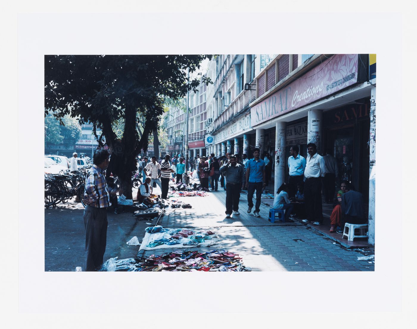 Street market with shop-cum-flats in the background, Sector 22, Chandigarh, India