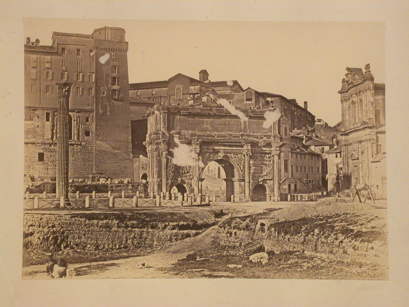 View of the Colosseum, exterior, and the Arch of Septimus Severus, in Roman Forum, Rome, Italy
