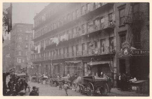 View of tenement houses where some residents work at home finishing garments, 260-268 Elizabeth Street, New York City, New York, United States