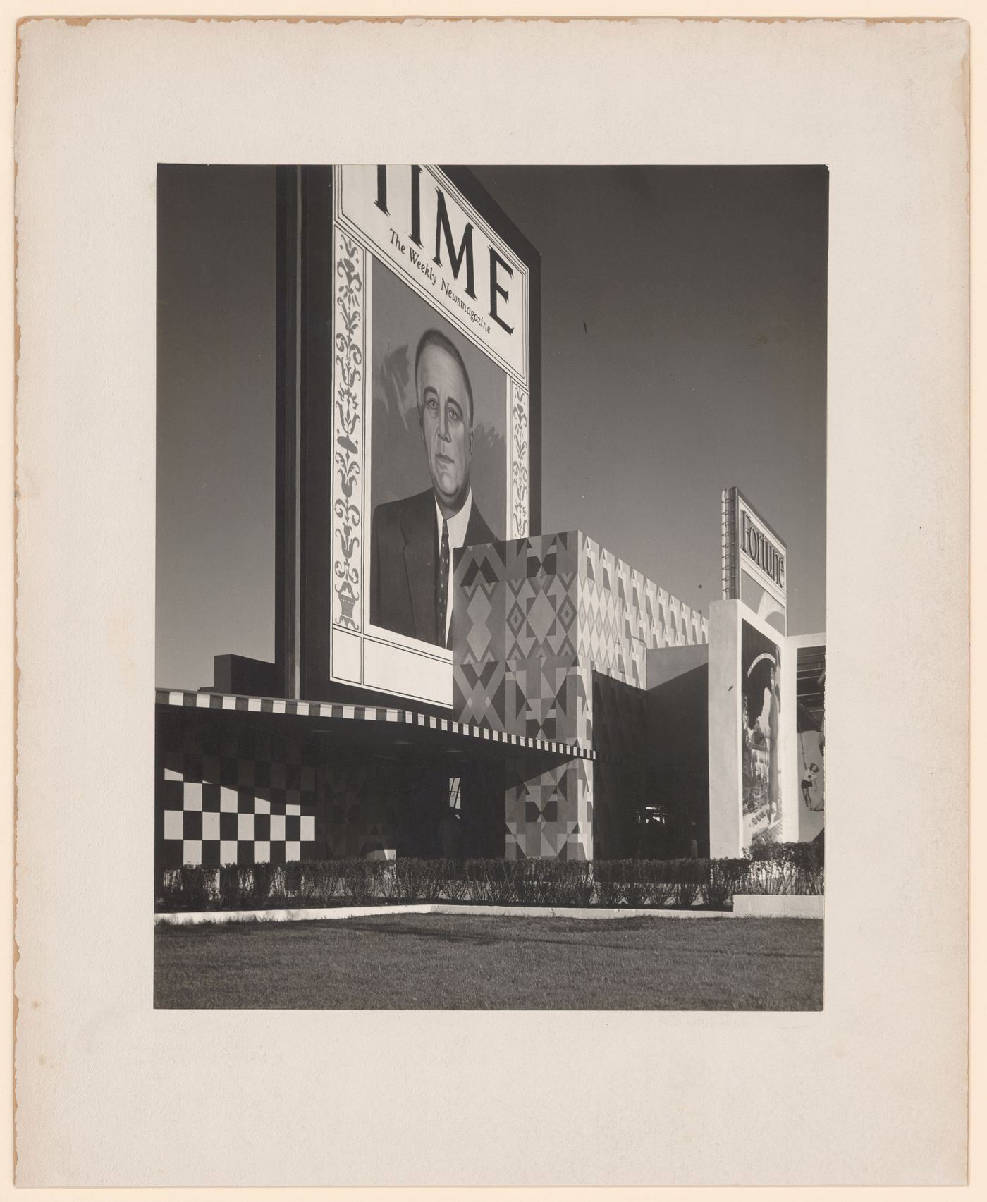 New York World's Fair (1939-1940): Geometric painted building façade with large ads for Time & Fortune Magazines on top