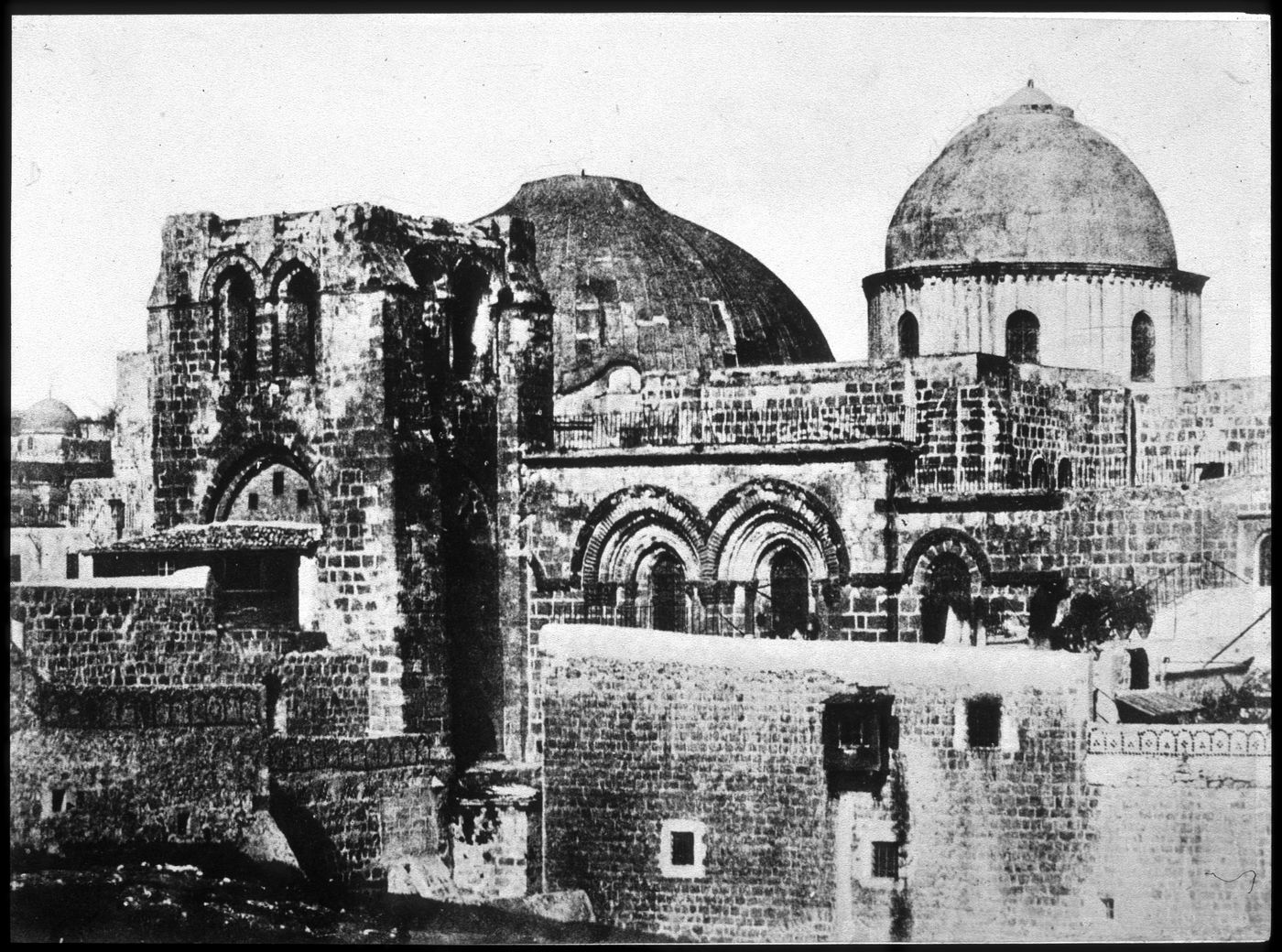 Church of the Holy Sepulchre, view of entrance façade, including, belfrey dome over the rotunda, uppermost part of entrance, and dome over "Center of the World", Jerusalem, Palestine