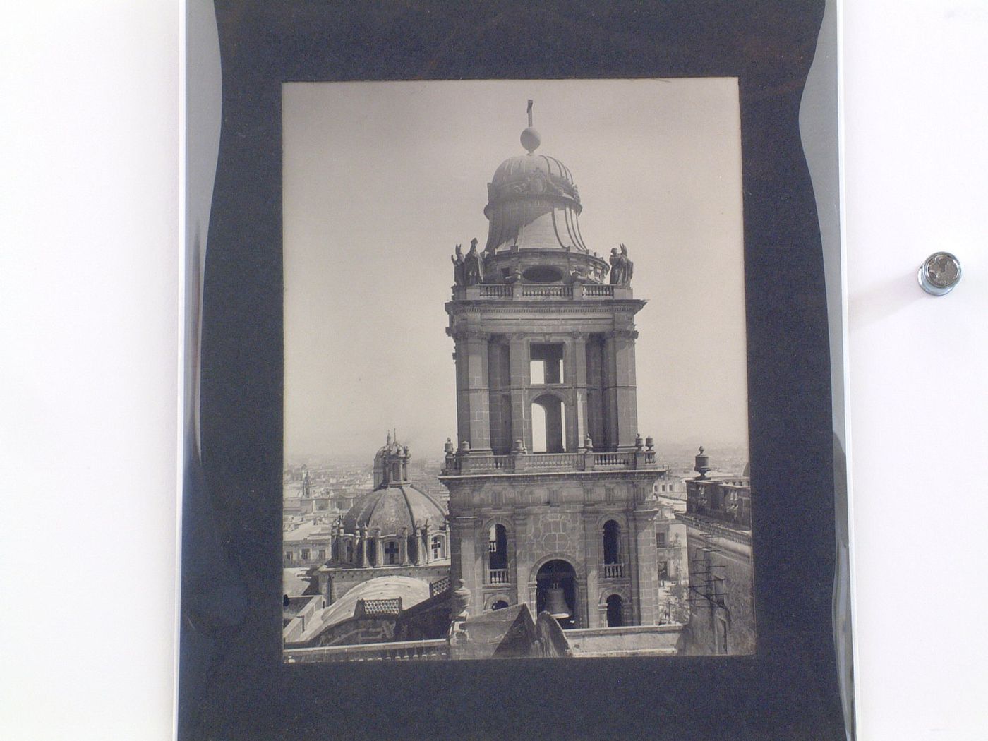 View of the Eastern tower of the Catedral de México showing the dome of the Sagrario Chapel and Mexico City in the background, Mexico