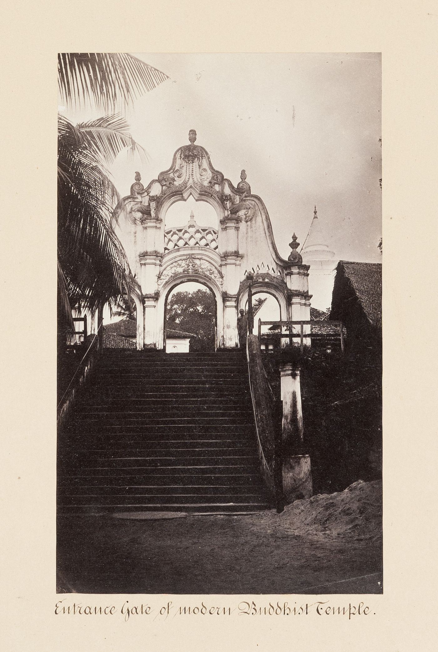 View of a staircase and the entrance gate of a Buddhist temple, near Colombo, Ceylon (now Sri Lanka)