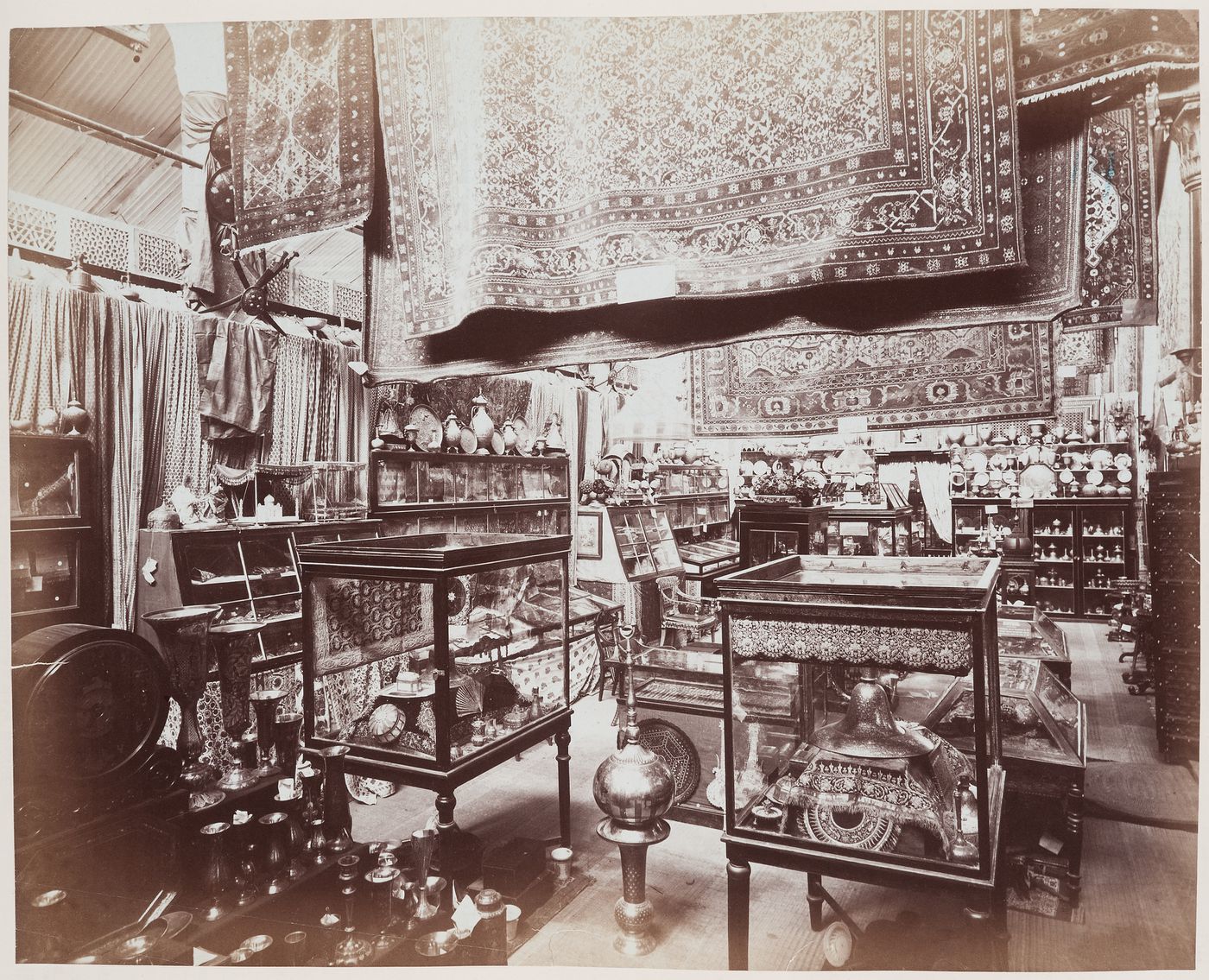 Interior view of a pavilion showing the North-West Provinces exhibit, Calcutta International Exhibition of 1883-1884, India