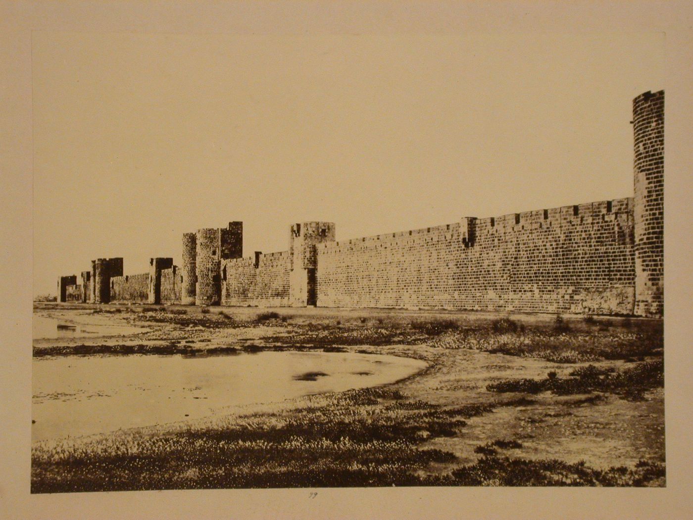 View along the city wall showing towers, Aigues-Mortes, France