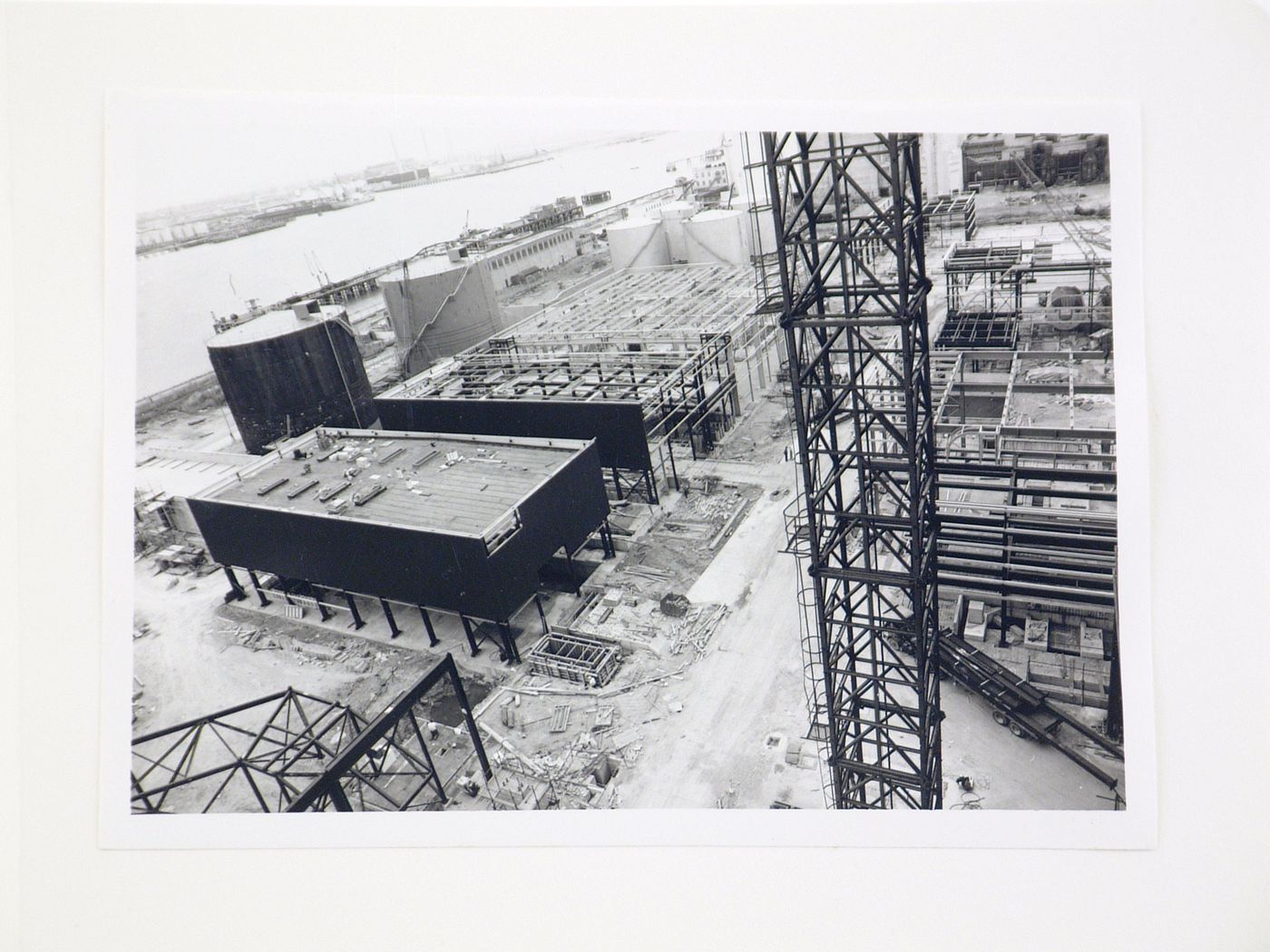 View of construction of power station by river, United Kingdom